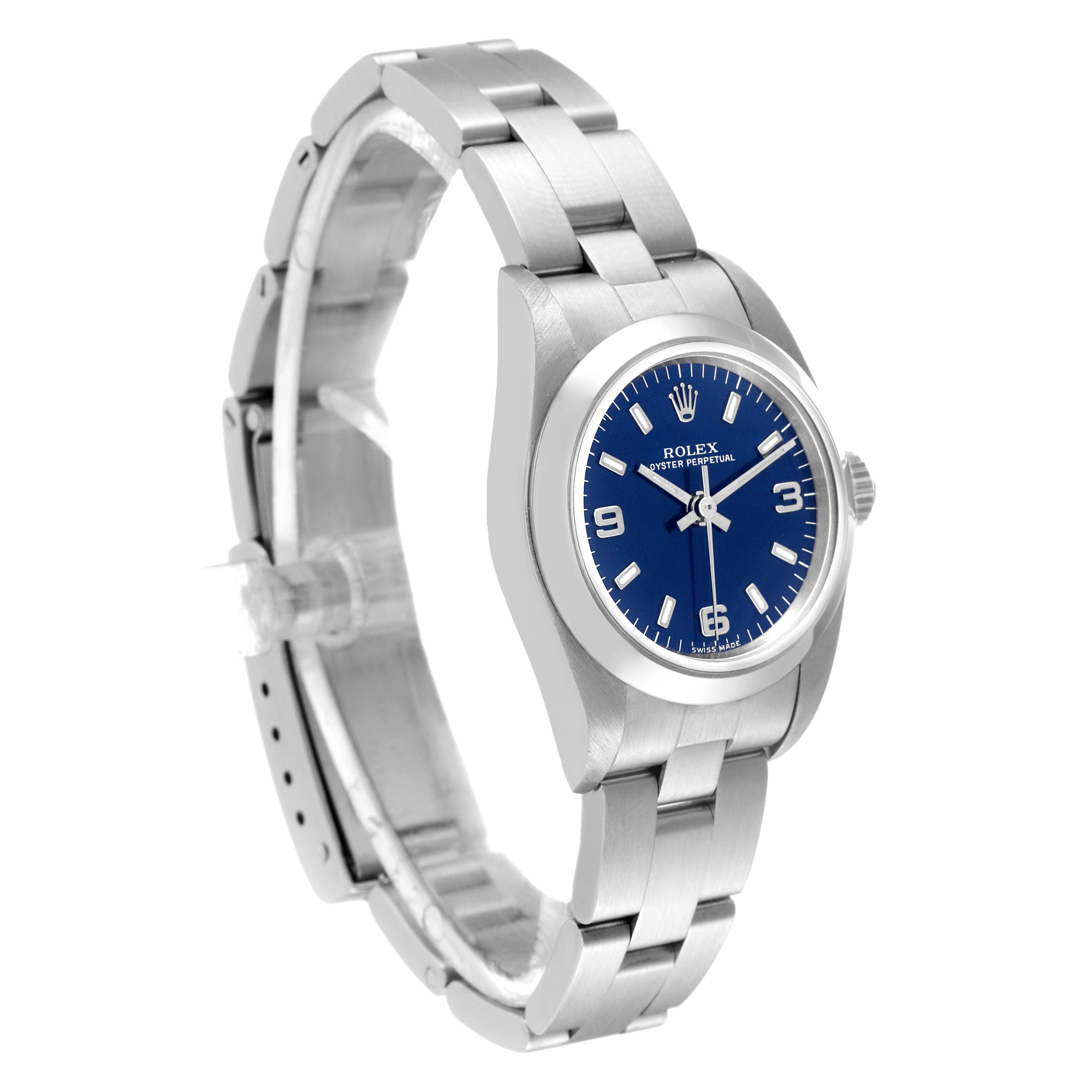 The image shows a three-quarter view of a Rolex Oyster Perpetual 76080 Women's Stainless Steel Blue Dial 76080 Women's Stainless Steel Blue Dial watch, showcasing the face, bezel, case, and bracelet.