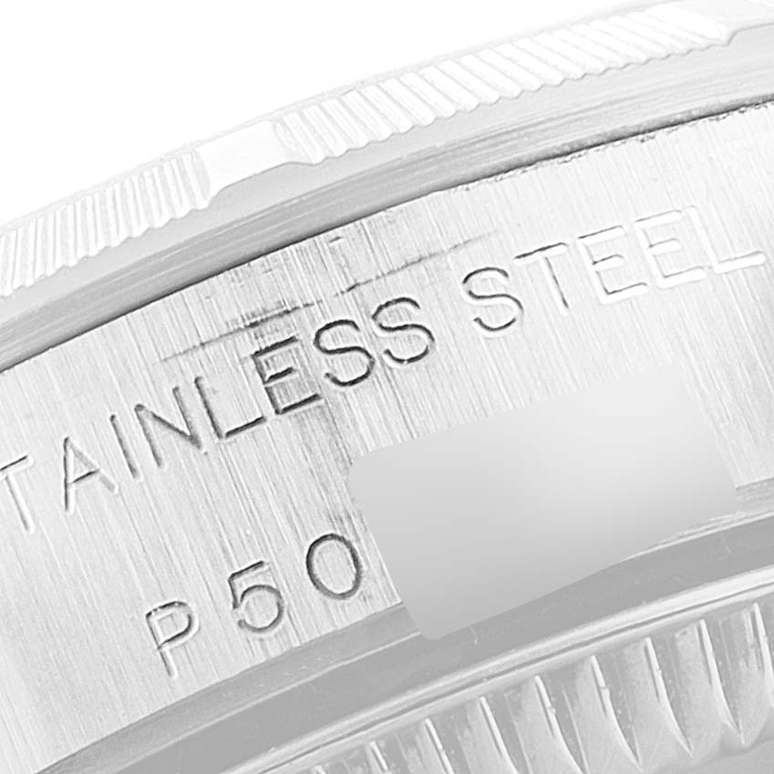 This image shows a close-up of the engraved stainless steel case back of a Rolex Oyster Perpetual 76030 Women
s Stainless Steel Blue Dial 76030 Women
s Stainless Steel Blue Dial watch.