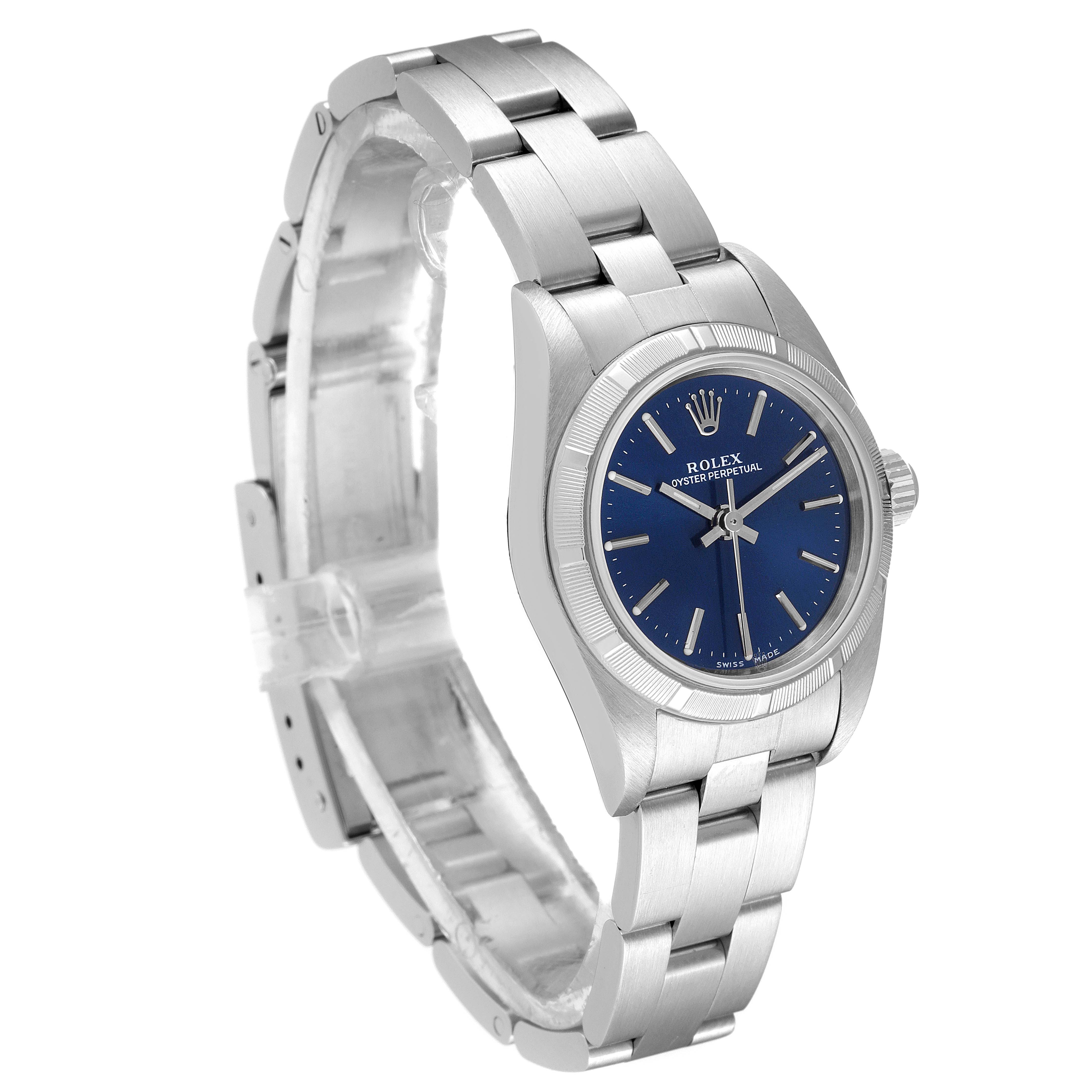 This image shows a Rolex Oyster Perpetual 76030 Women
s Stainless Steel Blue Dial 76030 Women
s Stainless Steel Blue Dial watch from a 3/4 side angle, highlighting its blue dial and stainless steel bracelet.