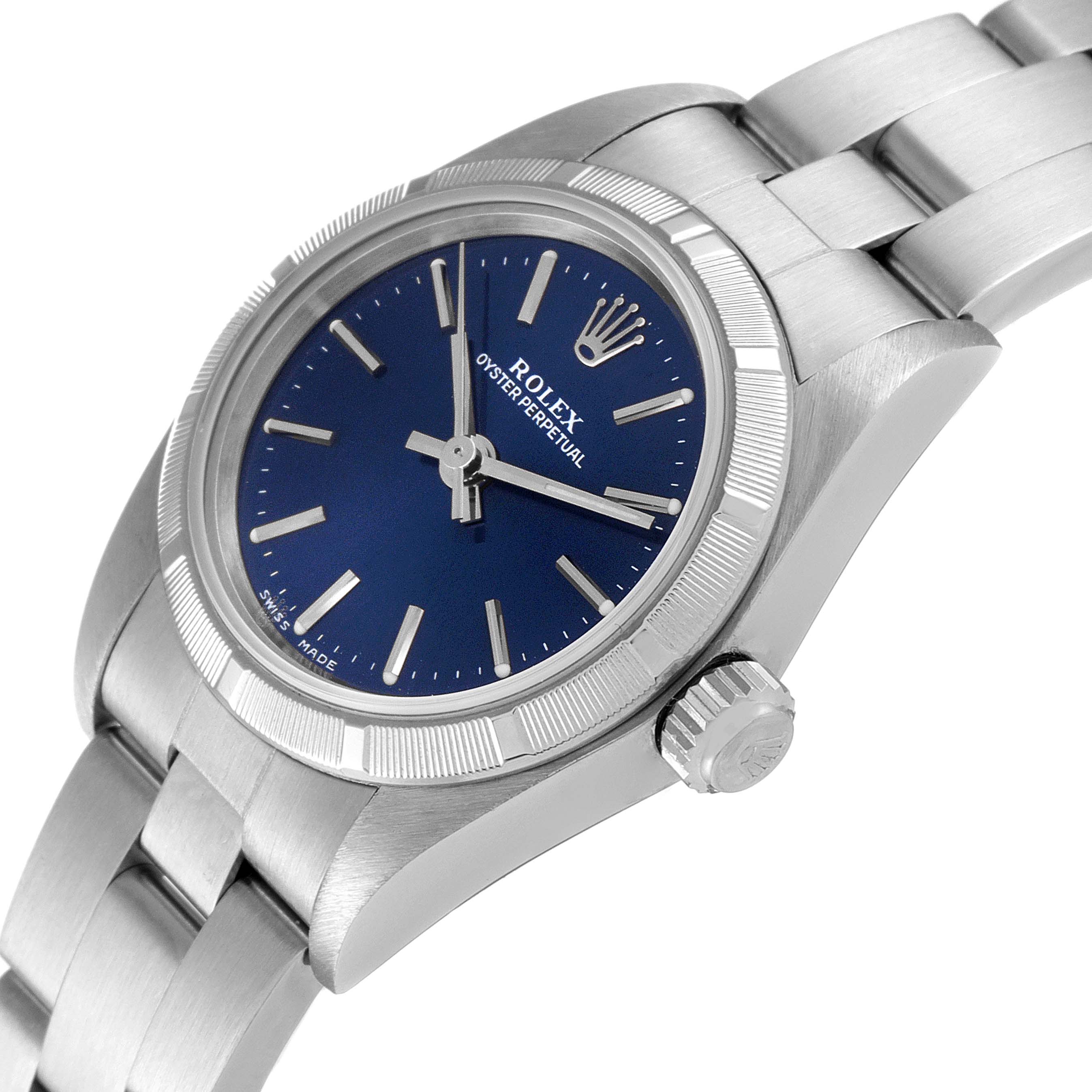 The image shows a side angle of a Rolex Oyster Perpetual 76030 Women
s Stainless Steel Blue Dial 76030 Women
s Stainless Steel Blue Dial watch, highlighting its blue dial, crown, and stainless steel bracelet.