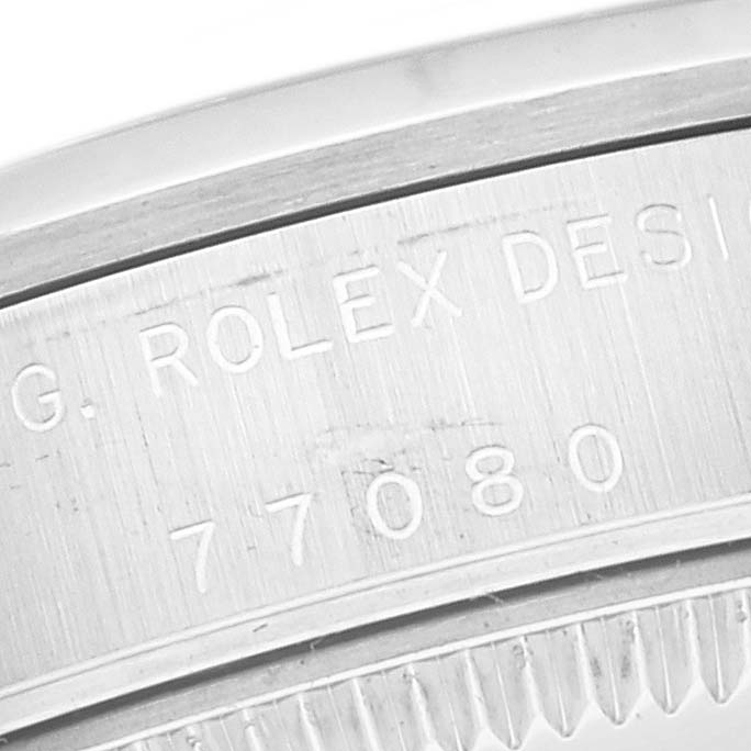 This image shows a close-up of the engraved model number on the case side of a Rolex Mid-Size 77080 Women
s Stainless Steel Blue Dial 77080 Women
s Stainless Steel Blue Dial watch.
