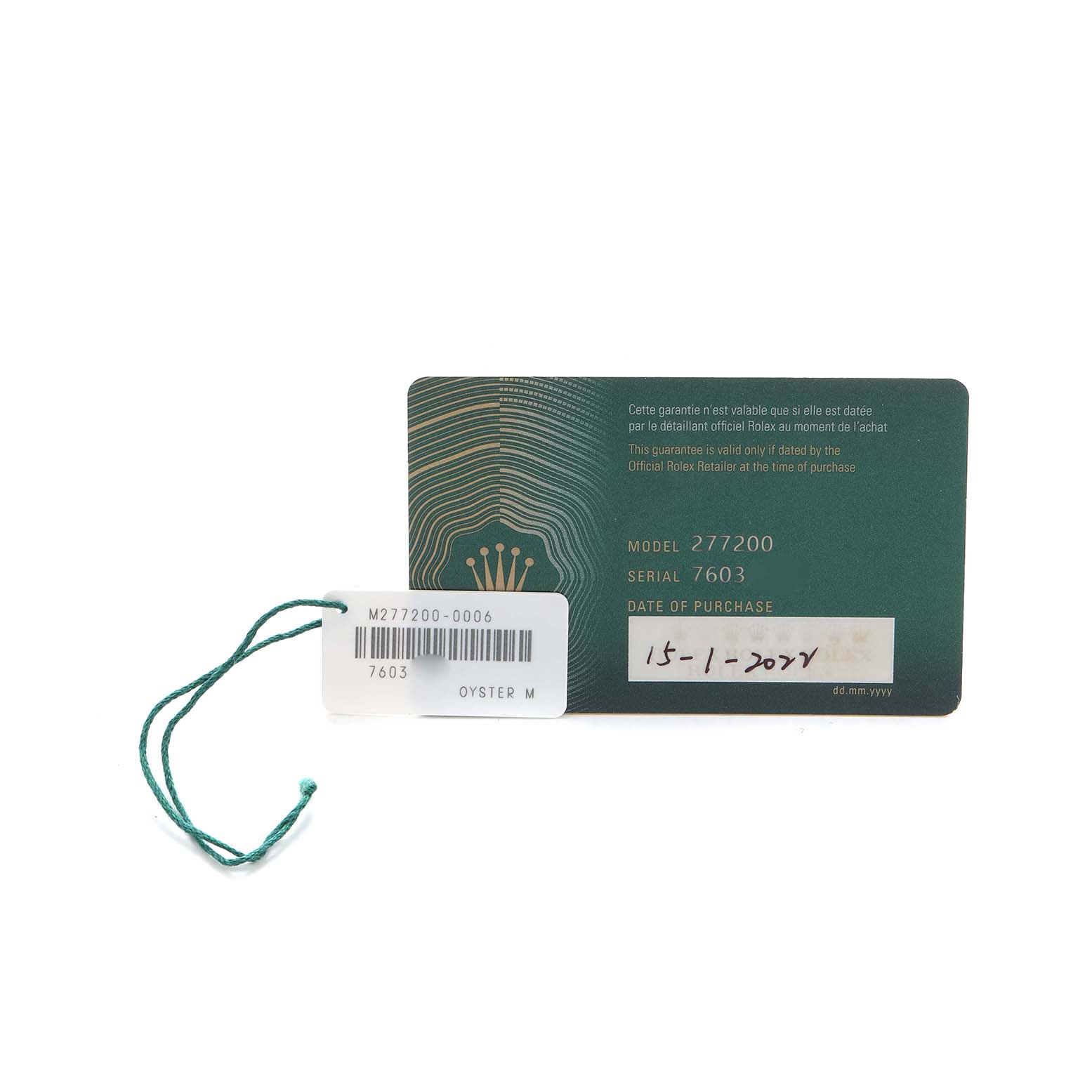The image shows a warranty card and tag for a Rolex Mid-Size 277200 Women's Stainless Steel Green Dial model, displaying model and serial numbers.