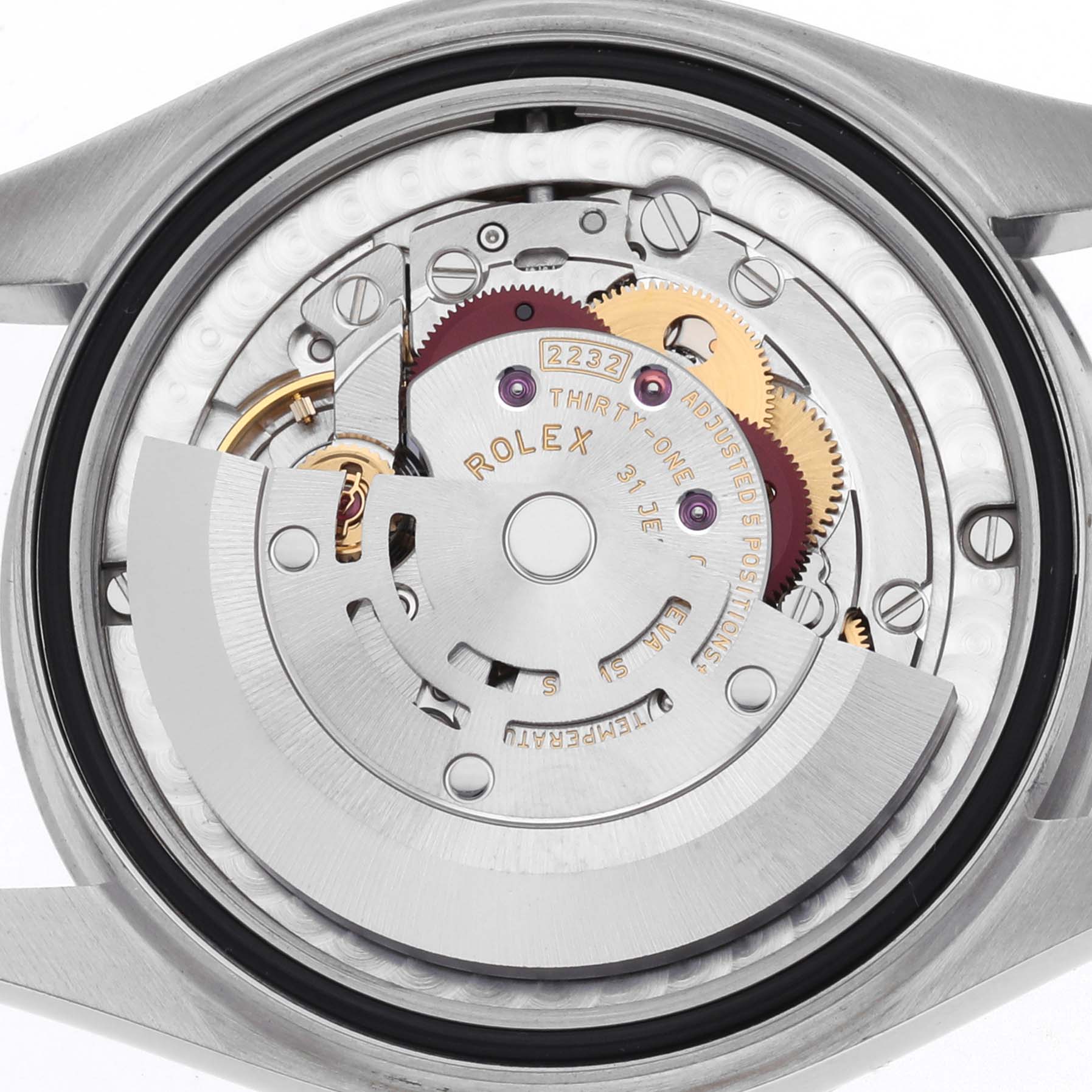 The image shows the internal mechanism of a Rolex Mid-Size 277200 Women's Stainless Steel Green Dial watch, featuring gears and the rotor.