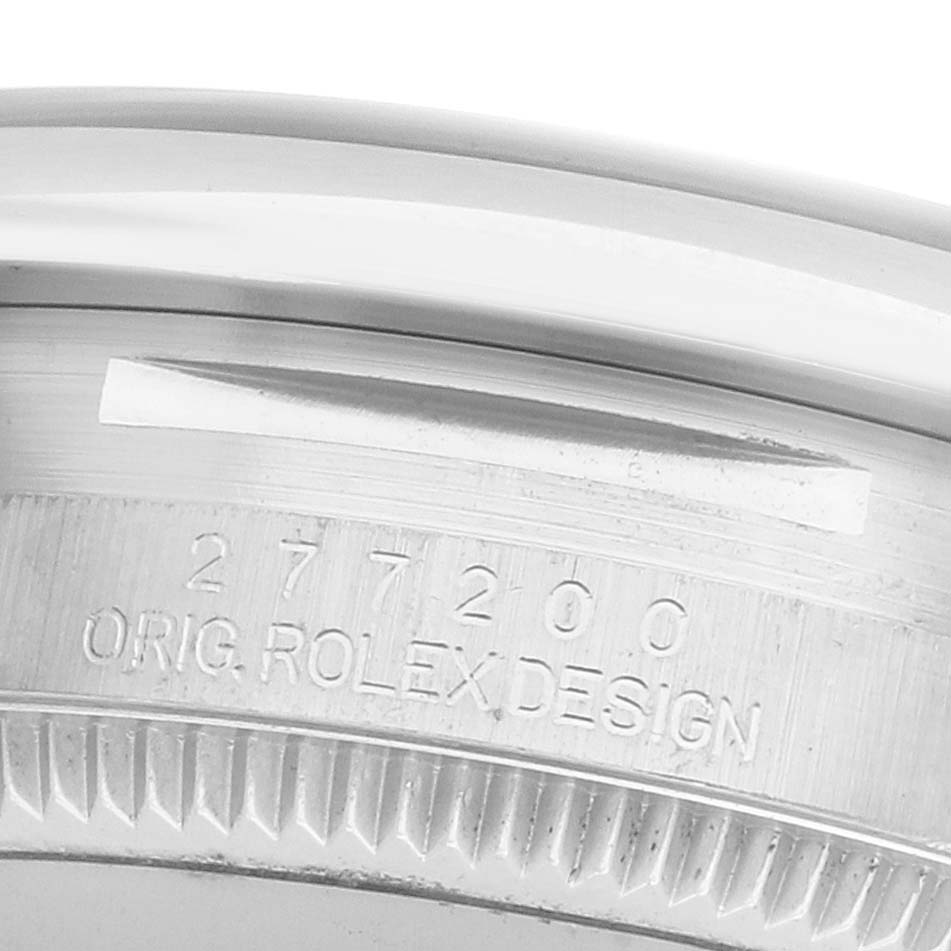 The image shows a close-up of the case edge and engraved serial number of the Rolex Mid-Size 277200 Women's Stainless Steel Green Dial model.