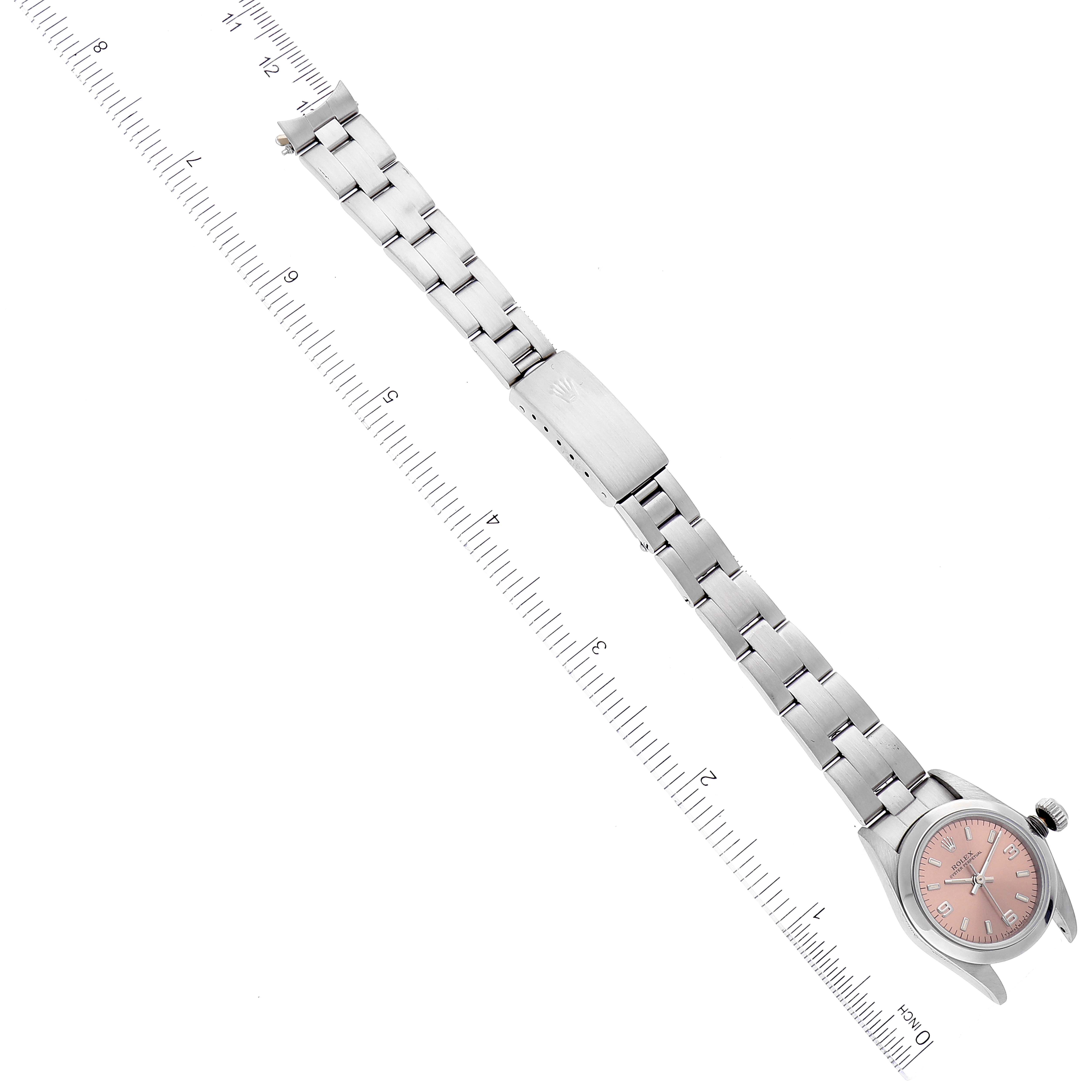 The Rolex Oyster Perpetual 67180 Women's Stainless Steel Pink Dial 67180 Women's Stainless Steel Pink Dial watch is shown from above, displaying the bracelet, clasp, and watch face.