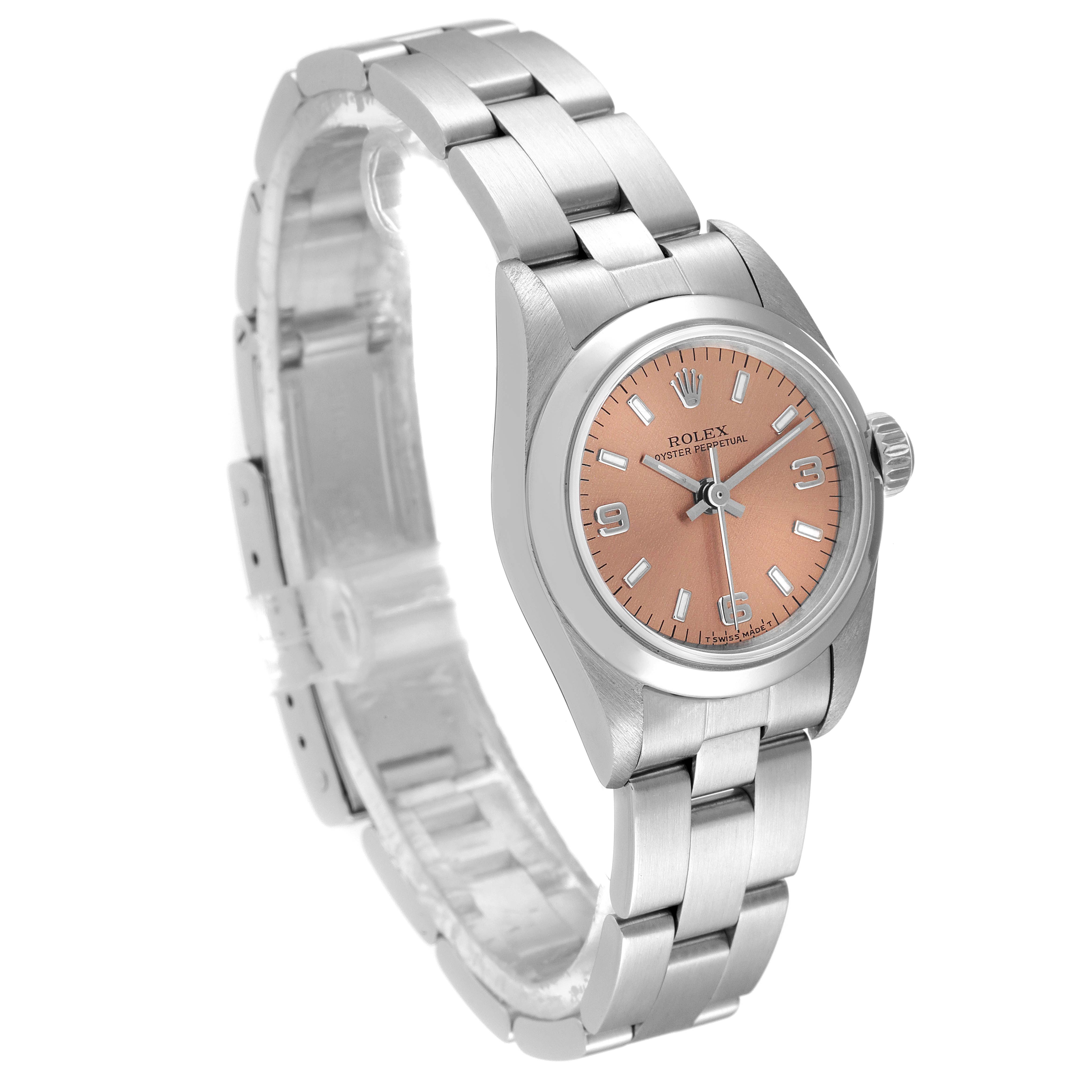 This image shows a side angle view of the Rolex Oyster Perpetual 67180 Women
s Stainless Steel Pink Dial 67180 Women
s Stainless Steel Pink Dial watch highlighting its face, bezel, bracelet, and clasp.