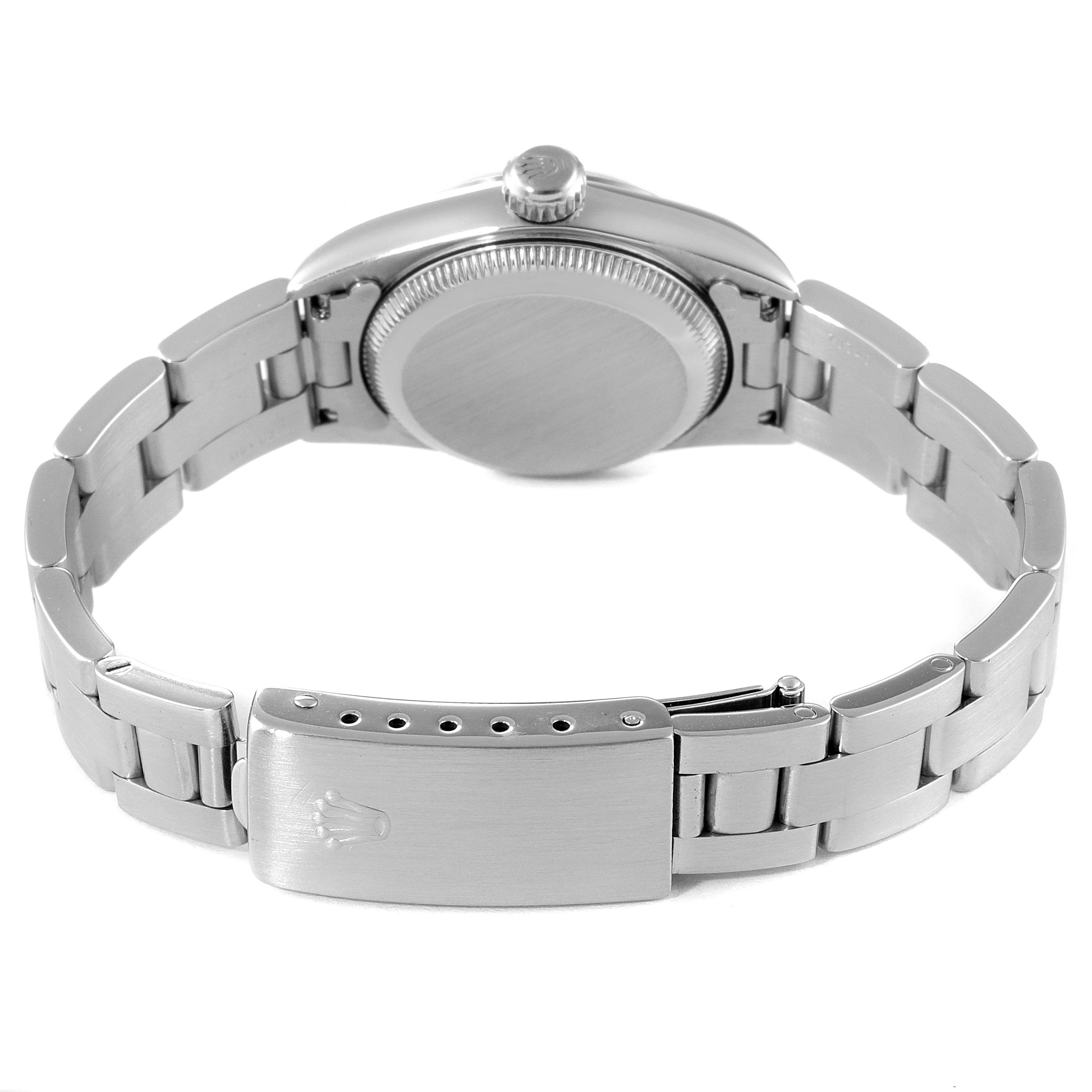 The image shows the back view of a Rolex Oyster Perpetual 67180 Women
s Stainless Steel Pink Dial 67180 Women
s Stainless Steel Pink Dial watch, highlighting the case back, bracelet, and clasp.