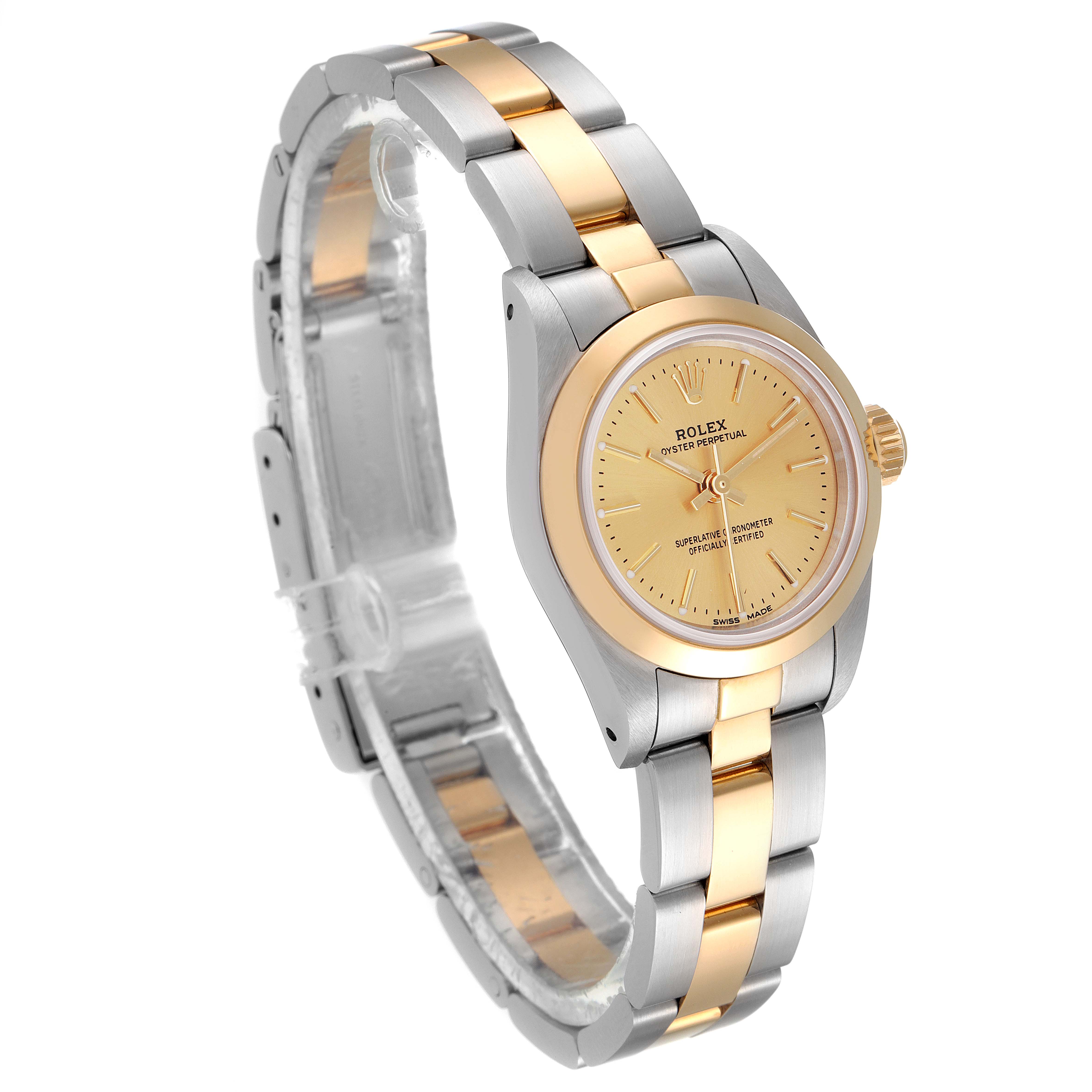 The Rolex Oyster Perpetual 67183 Women
s Steel and Gold (two tone) Champagne Dial 67183 Women
s Steel and Gold (two tone) Champagne Dial watch is shown at a slight angle, highlighting its two-tone bracelet and champagne dial.