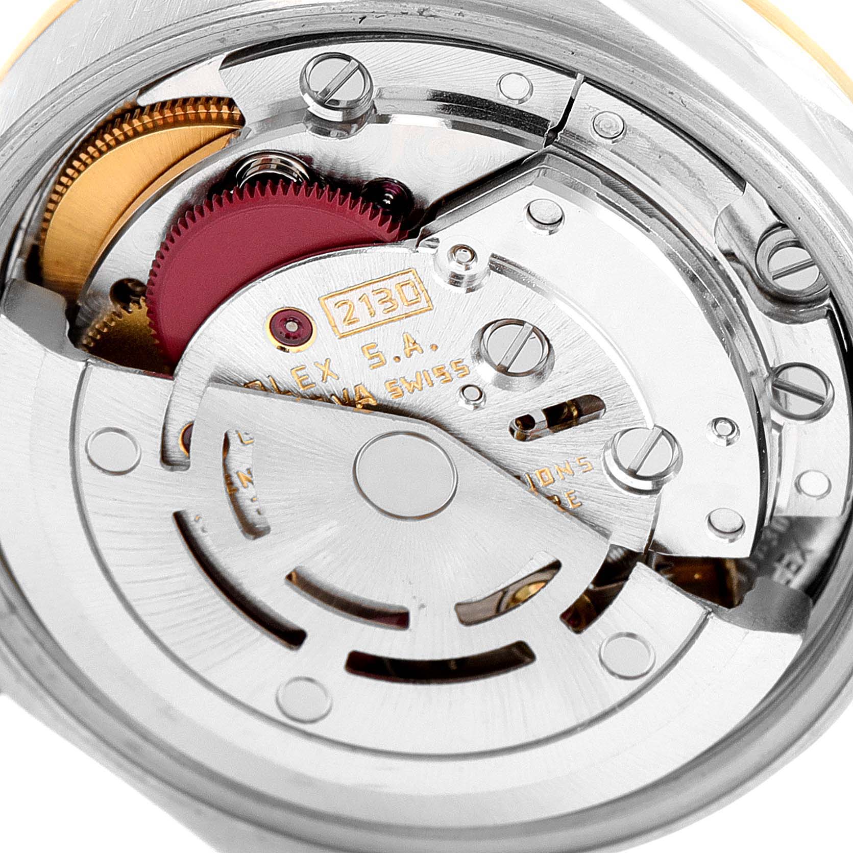 This image shows the internal mechanism of a Rolex Oyster Perpetual 67183 Women
s Steel and Gold (two tone) Champagne Dial 67183 Women
s Steel and Gold (two tone) Champagne Dial watch from a close-up angle.