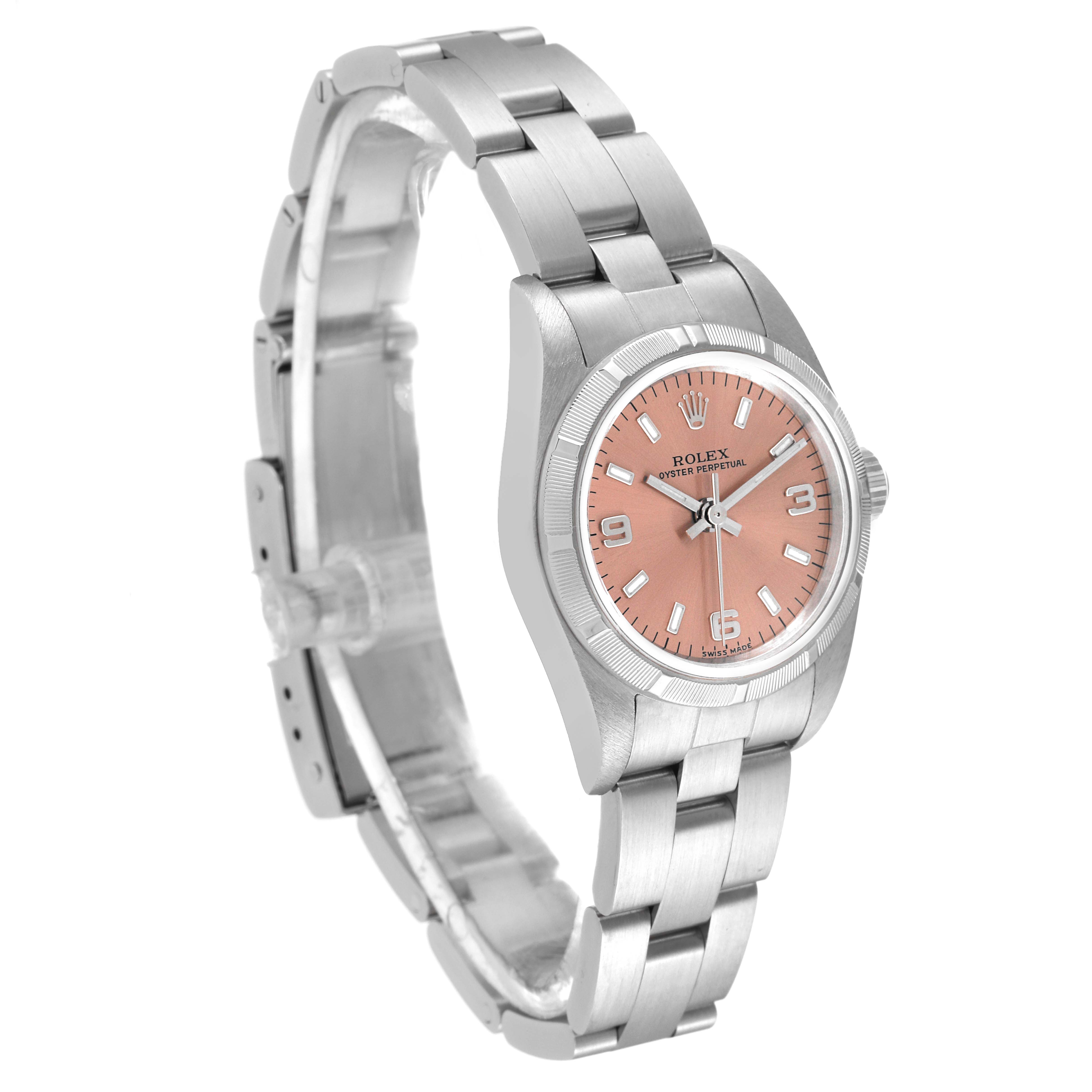 The image shows a Rolex Oyster Perpetual 76030 Women's Stainless Steel Pink Dial 76030 Women's Stainless Steel Pink Dial watch at a three-quarter angle, highlighting its bracelet, case, and salmon dial.