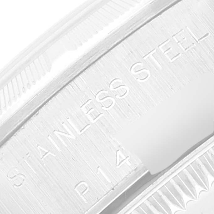 This image shows a close-up of the case back of a Rolex Oyster Perpetual 76030 Women's Stainless Steel Pink Dial 76030 Women's Stainless Steel Pink Dial, highlighting the "Stainless Steel" inscription.