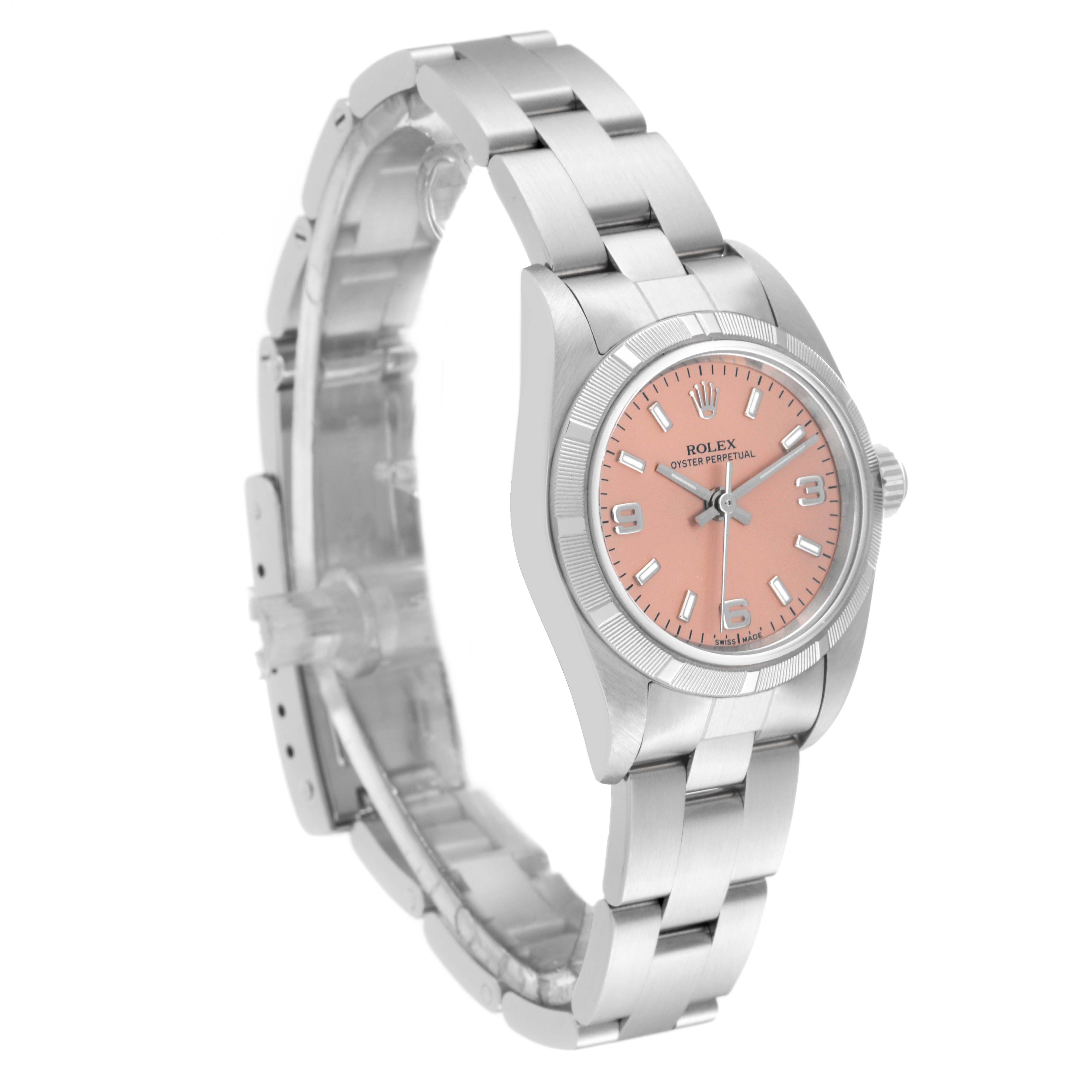 This image shows a Rolex Oyster Perpetual 76030 Women
s Stainless Steel Pink Dial 76030 Women
s Stainless Steel Pink Dial watch with a pink dial, viewed from an angled side perspective.