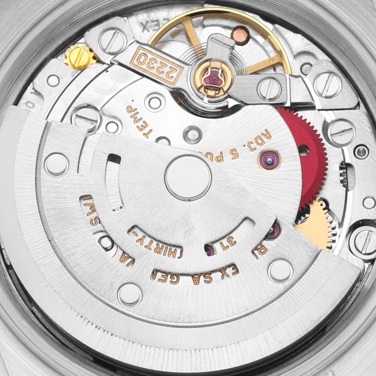 The image shows a close-up of the movement and inner mechanical parts of the Rolex Oyster Perpetual 76030 Women
s Stainless Steel Pink Dial 76030 Women
s Stainless Steel Pink Dial watch.