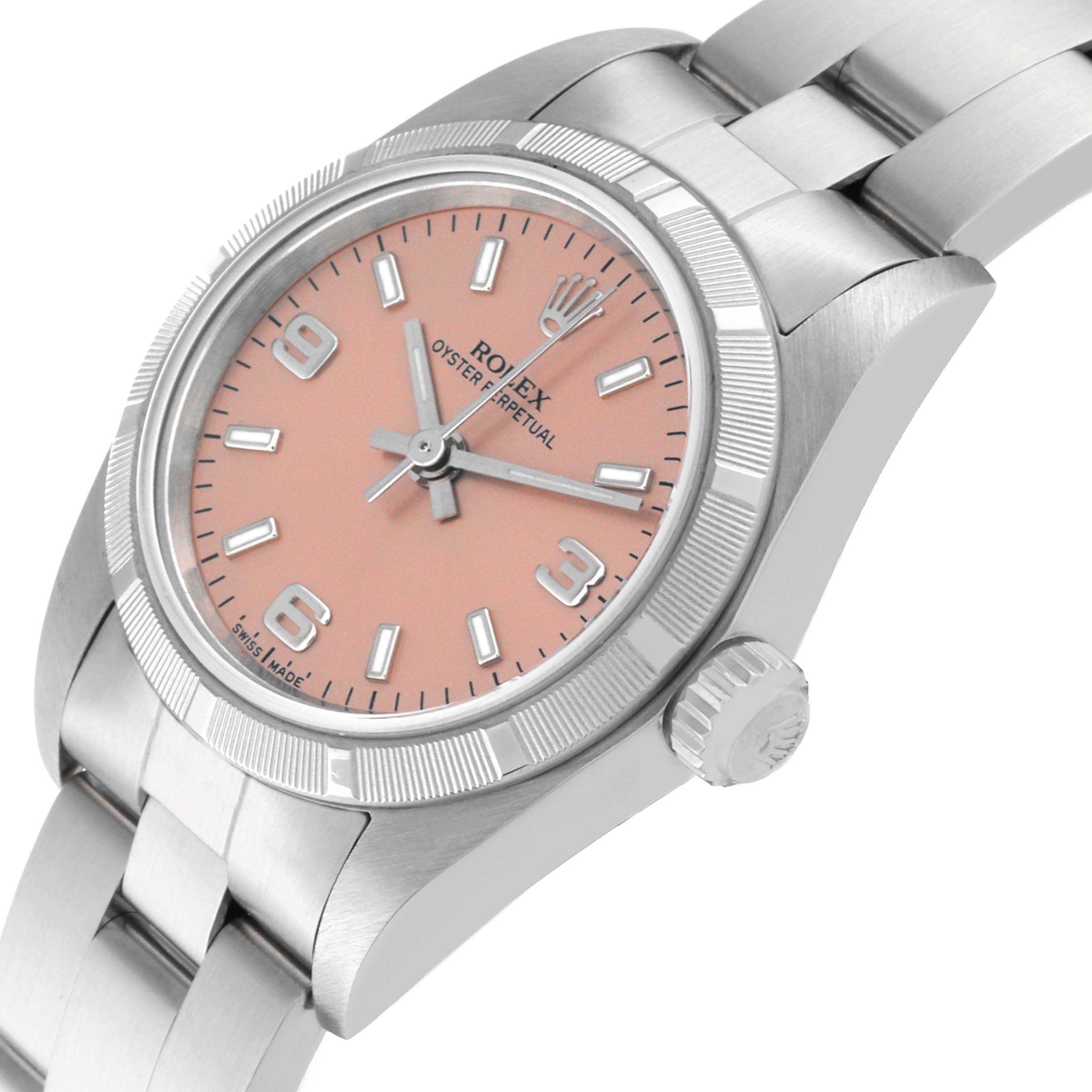 This image shows a Rolex Oyster Perpetual 76030 Women
s Stainless Steel Pink Dial 76030 Women
s Stainless Steel Pink Dial watch at an angled view displaying the face, crown, and part of the bracelet.