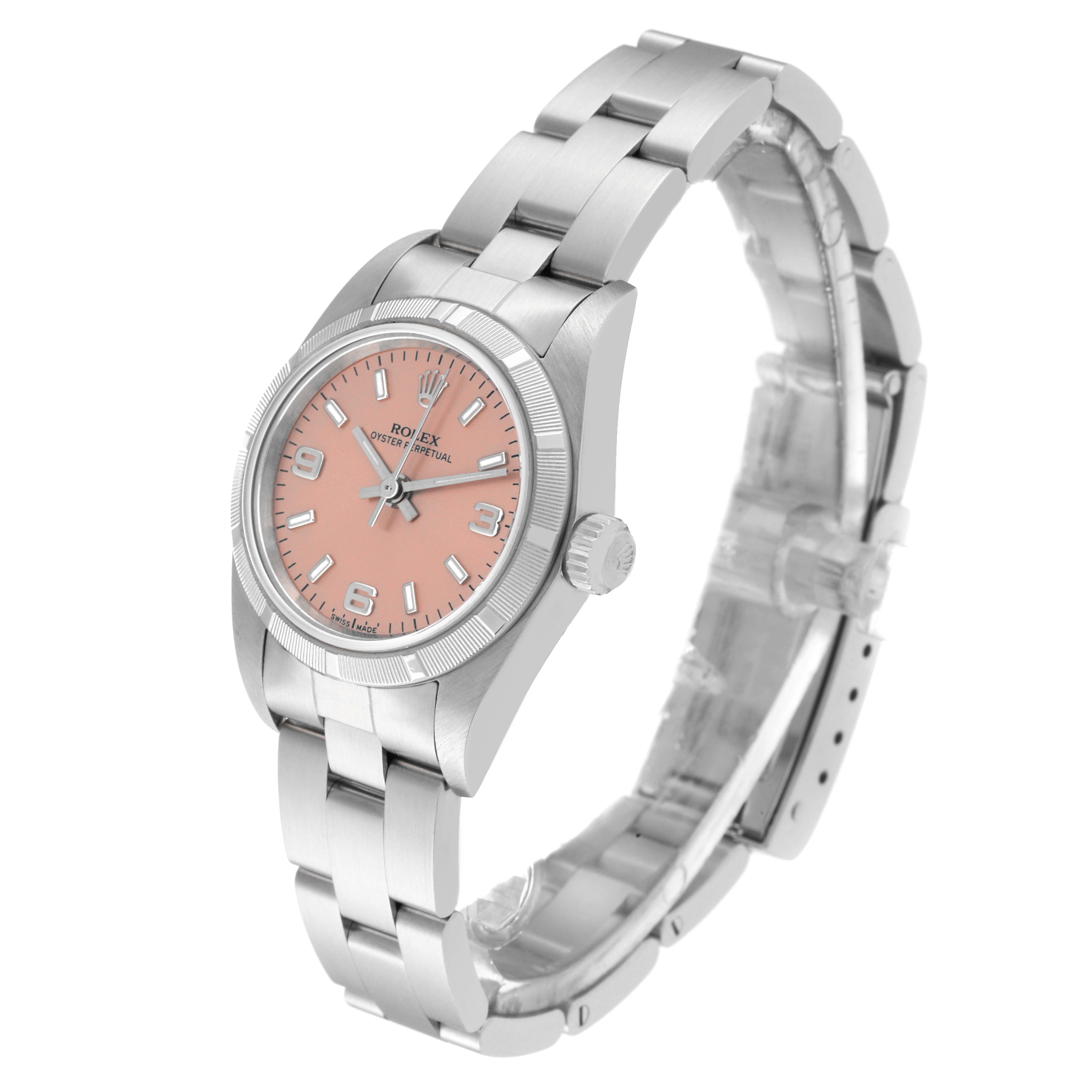 The image shows a Rolex Oyster Perpetual 76030 Women
s Stainless Steel Pink Dial 76030 Women
s Stainless Steel Pink Dial watch at an angle highlighting its face, crown, and bracelet.