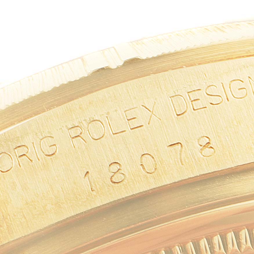 This close-up shows the side engravings of a Rolex President 18078 Men
s Yellow Gold Silver Dial 18078 Men
s Yellow Gold Silver Dial model watch.