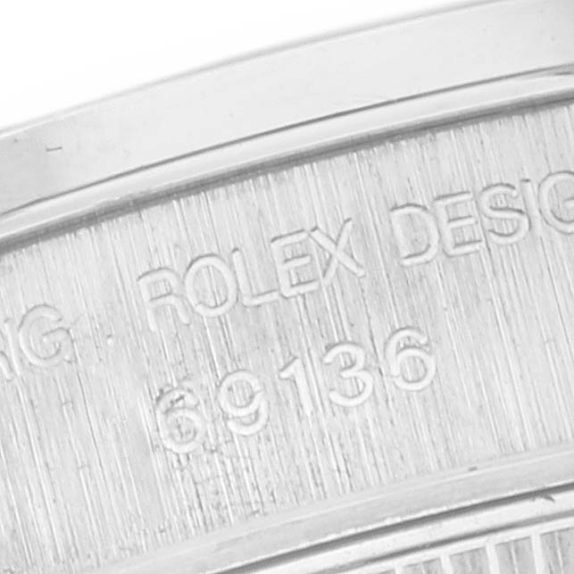The image shows a close-up of the case back engraving of a Rolex President 69136 Women's Platinum Silver Dial 69136 Women's Platinum Silver Dial watch, displaying the Rolex design number 69136.