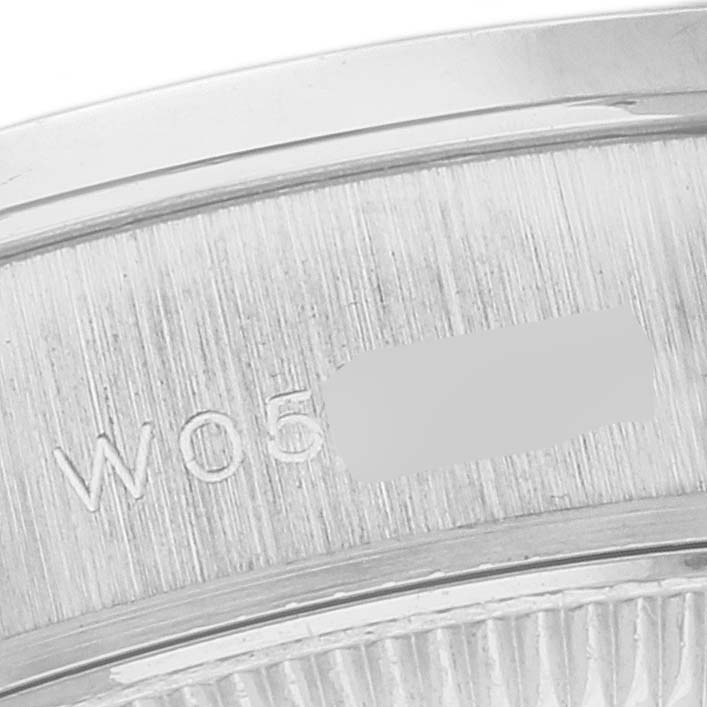 This close-up image shows the rim and serial number engraving on a Rolex President 69136 Women's Platinum Silver Dial 69136 Women's Platinum Silver Dial model watch.