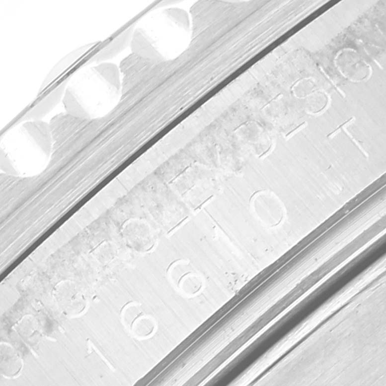 The image shows a close-up of the bezel and engraving on the case side of a Rolex Submariner 16610 Men's Stainless Steel Black Dial 16610 Men's Stainless Steel Black Dial watch.