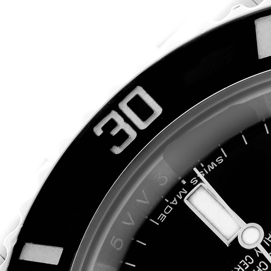 The image shows a close-up of the Rolex Submariner 114060 Men's Stainless Steel Black Dial's bezel, focusing on the "30" marker and part of the dial and hands.