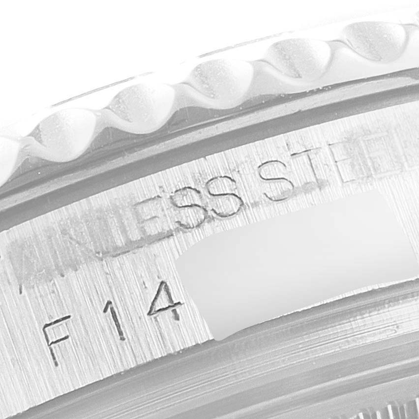 This close-up image shows the bezel and part of the case side, revealing "STAINLESS STEEL" engraving on a Rolex Yacht-Master 168622 Men's Stainless Steel Silver Dial 168622 Men's Stainless Steel Silver Dial watch.