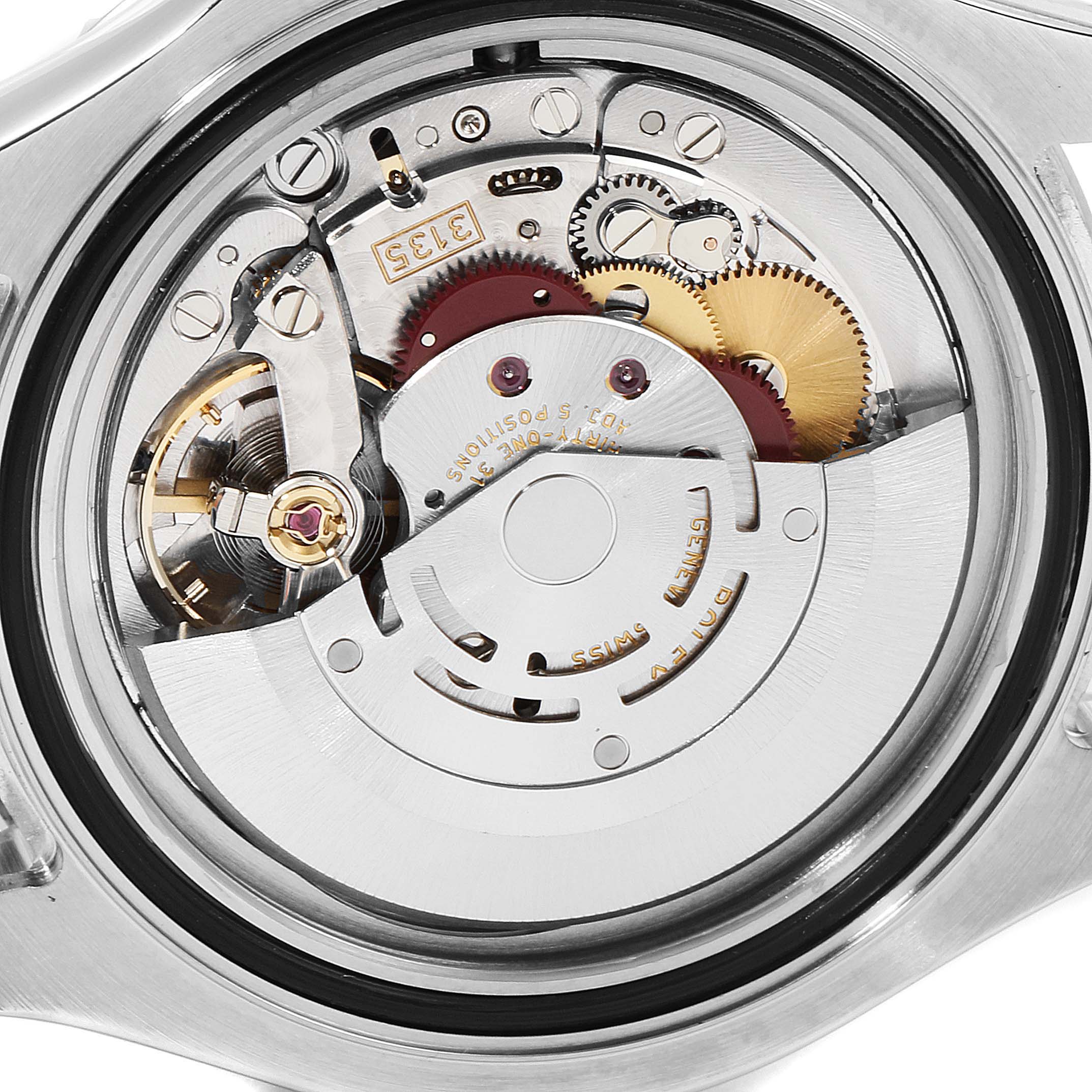 This image shows a close-up view of the internal mechanics of a Rolex Yacht-Master 16622 Men
s Stainless Steel Silver Dial 16622 Men
s Stainless Steel Silver Dial watch, highlighting its gears and movement components.