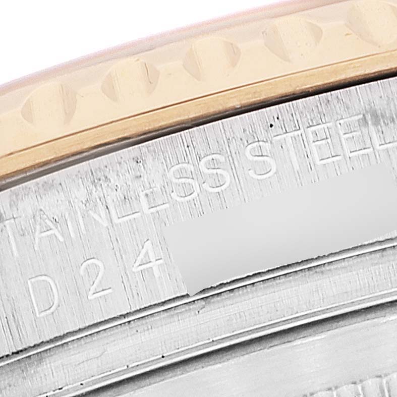 This close-up shows the engraved text and part of the bezel on a Rolex Yacht-Master 16623 Men's Steel and Gold (two tone) White Dial 16623 Men's Steel and Gold (two tone) White Dial watch.