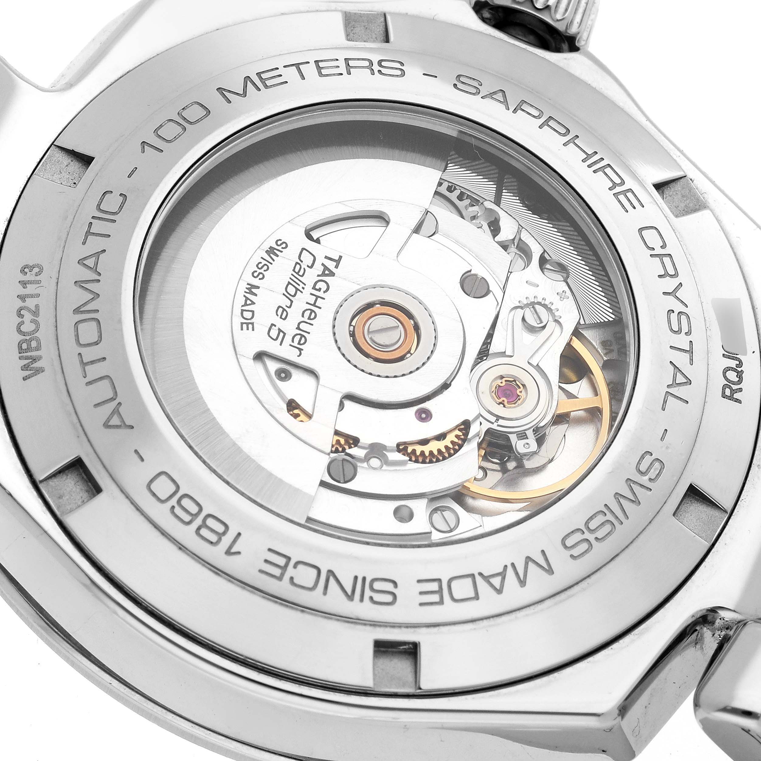 This image shows the back casing and internal mechanism of a Tag Heuer Link WBC2113.BA0603 Men's Stainless Steel Blue Dial WBC2113.BA0603 Men's Stainless Steel Blue Dial model watch, featuring sapphire crystal and automatic movement.