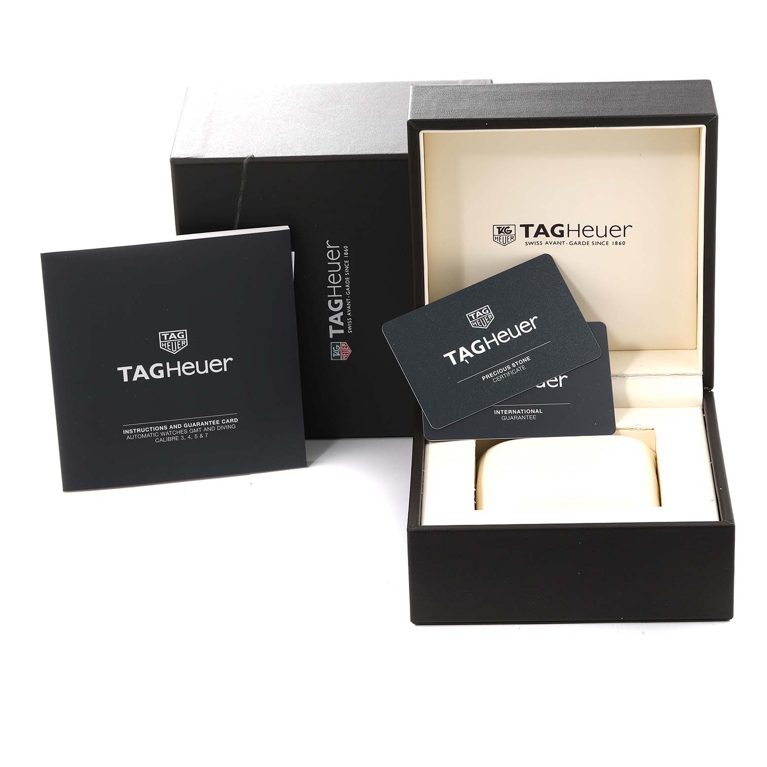 The image shows the packaging and documentation for a Tag Heuer Link WBC2113.BA0603 Men's Stainless Steel Blue Dial WBC2113.BA0603 Men's Stainless Steel Blue Dial model watch, including the box, instruction manual, and guarantee card.