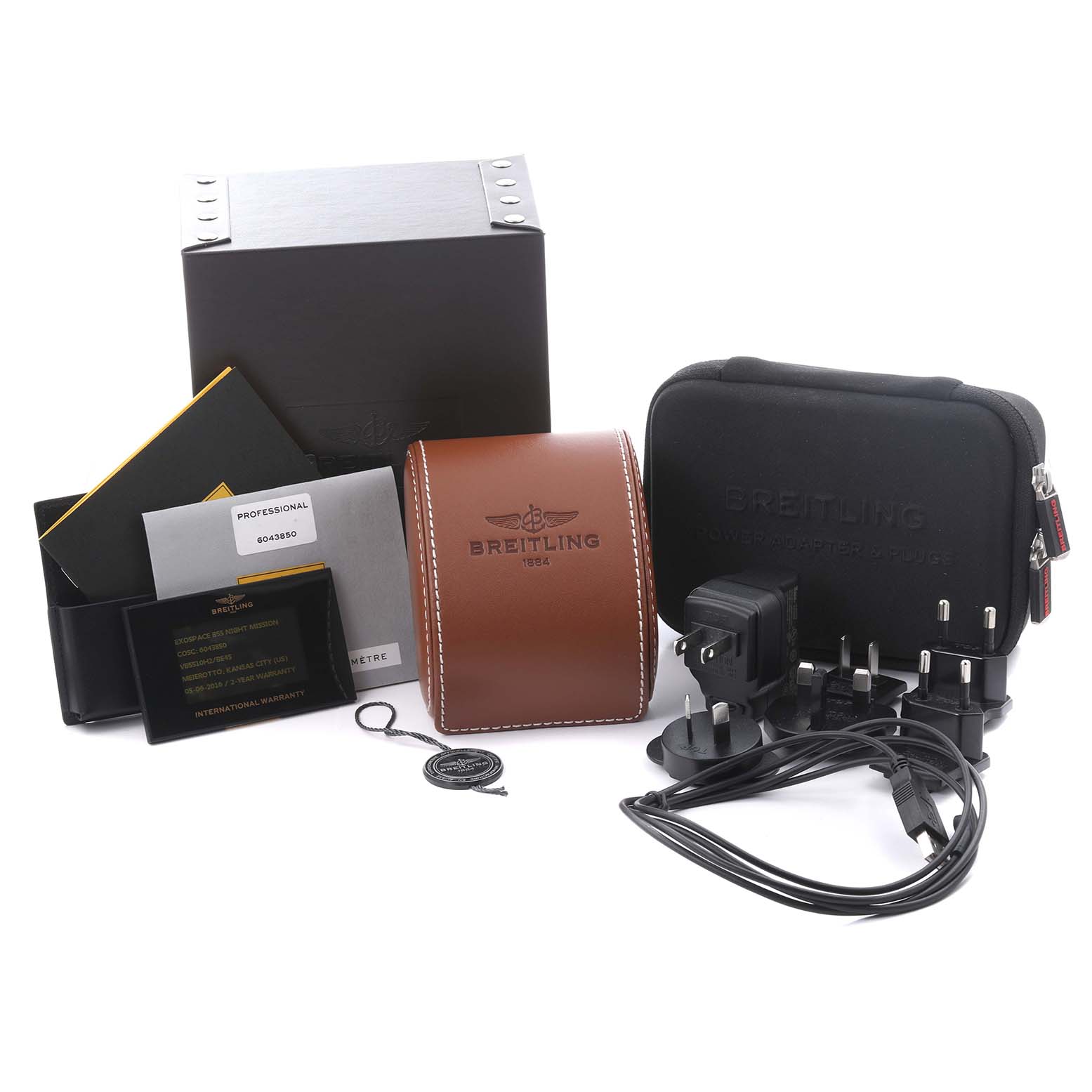 The image shows Breitling Professional Series VB5510 Men's Titanium Black Dial VB5510 Men's Titanium Black Dial accessories, including boxes, a travel case, documents, and charging adapters.