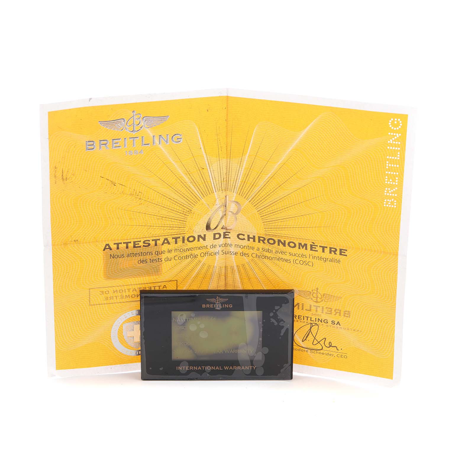 The image shows a Breitling Navitimer AB0127 Men's Stainless Steel Black Dial model's warranty card and chronometer certificate, positioned directly facing the viewer.