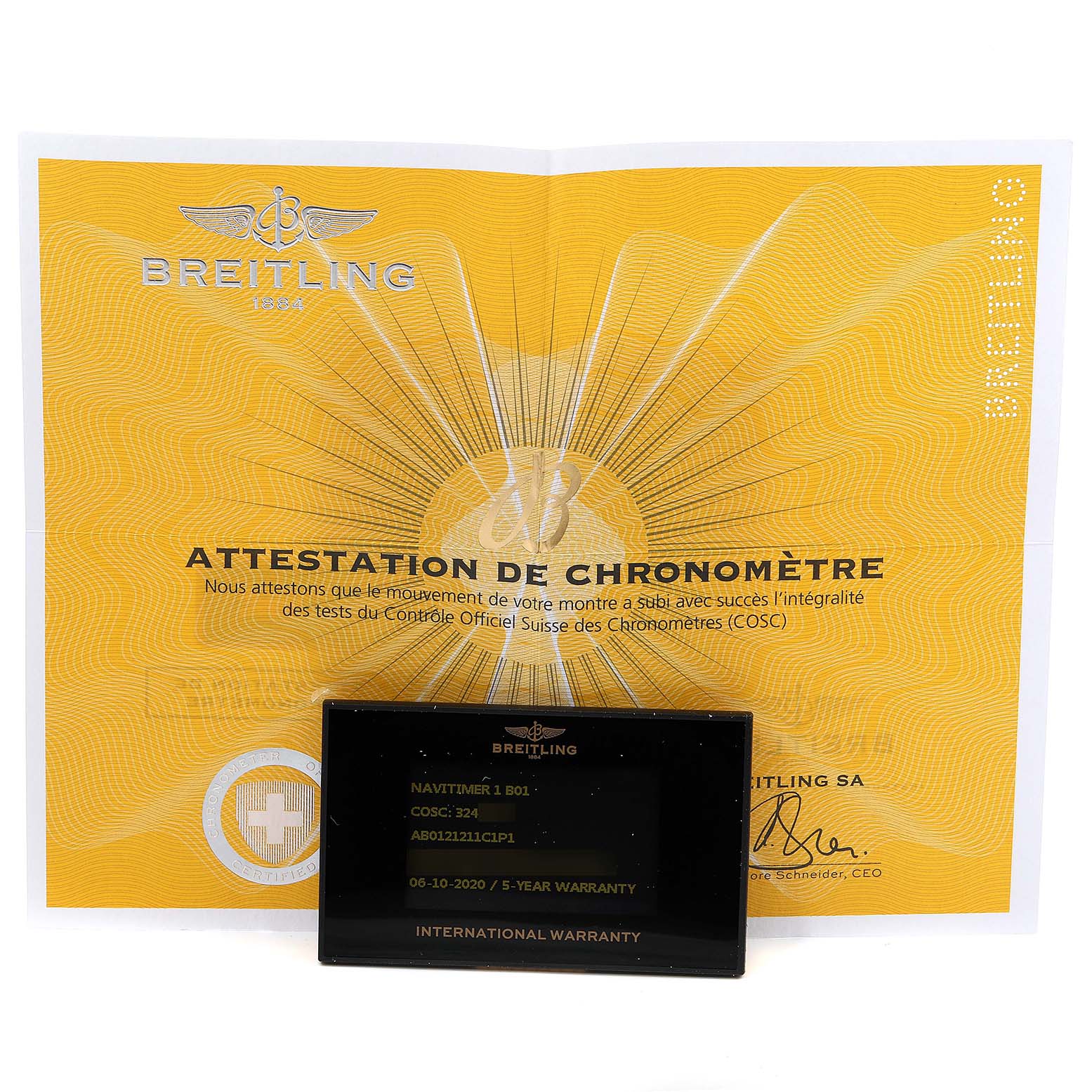 The image shows a Breitling Navitimer AB0121C4-C920-731P Men's Stainless Steel Blue Dial AB0121C4-C920-731P Men's Stainless Steel Blue Dial model's attestation certificate and an international warranty card.