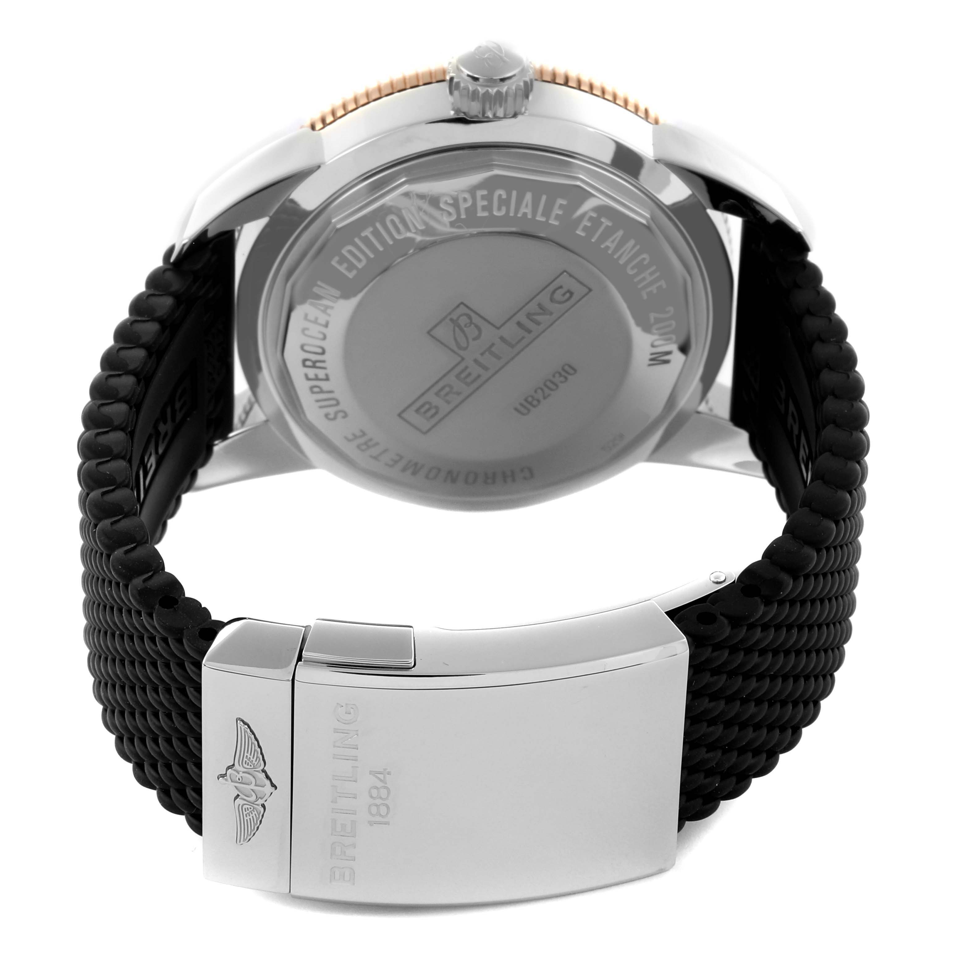 The Breitling Superocean UB2030 Men's Steel and Gold (two tone) Black Dial UB2030 Men's Steel and Gold (two tone) Black Dial watch is shown from the back, highlighting the case back and black strap with the clasp visible.