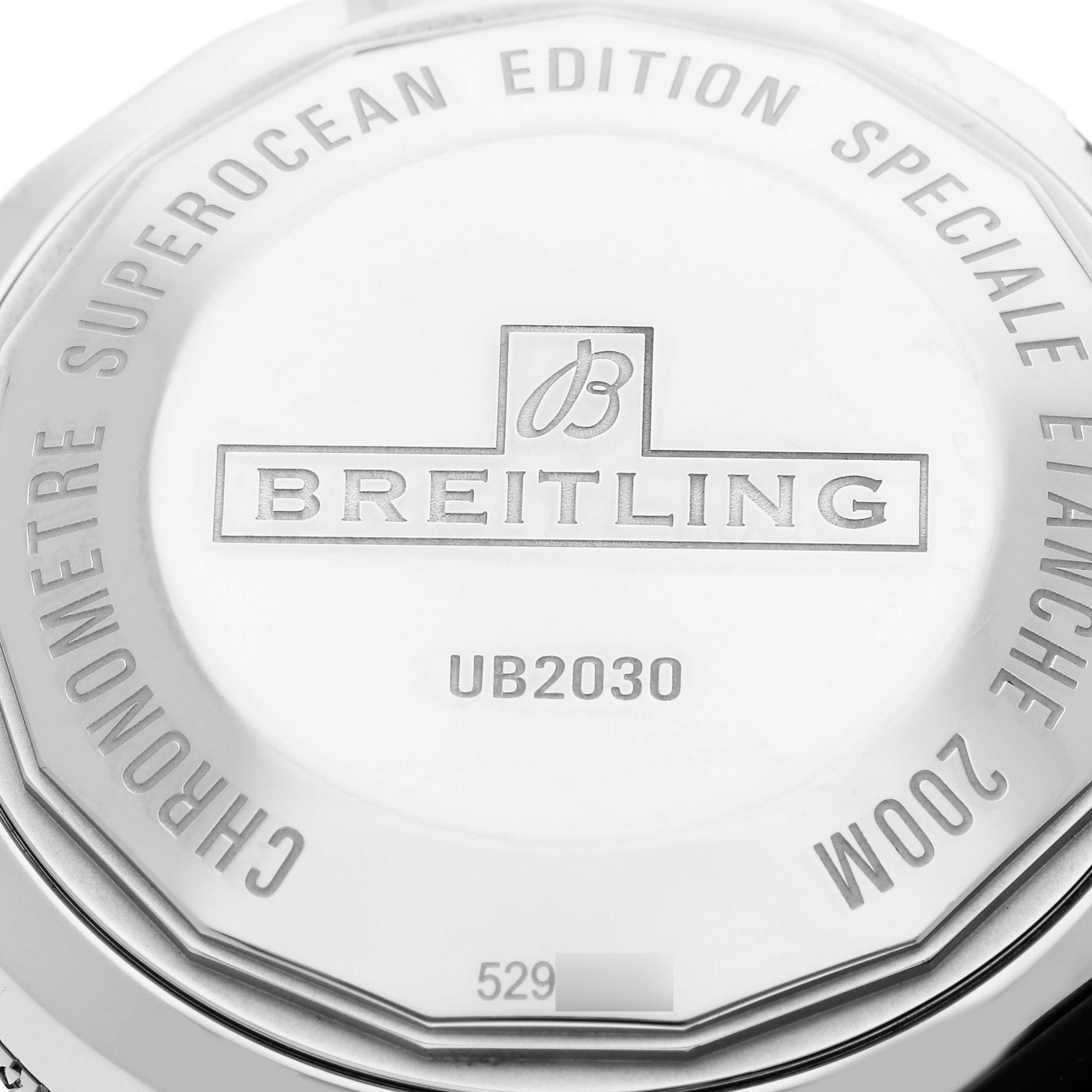 The image shows the back case of the Breitling Superocean UB2030 Men's Steel and Gold (two tone) Black Dial UB2030 Men's Steel and Gold (two tone) Black Dial watch with engravings and model details.