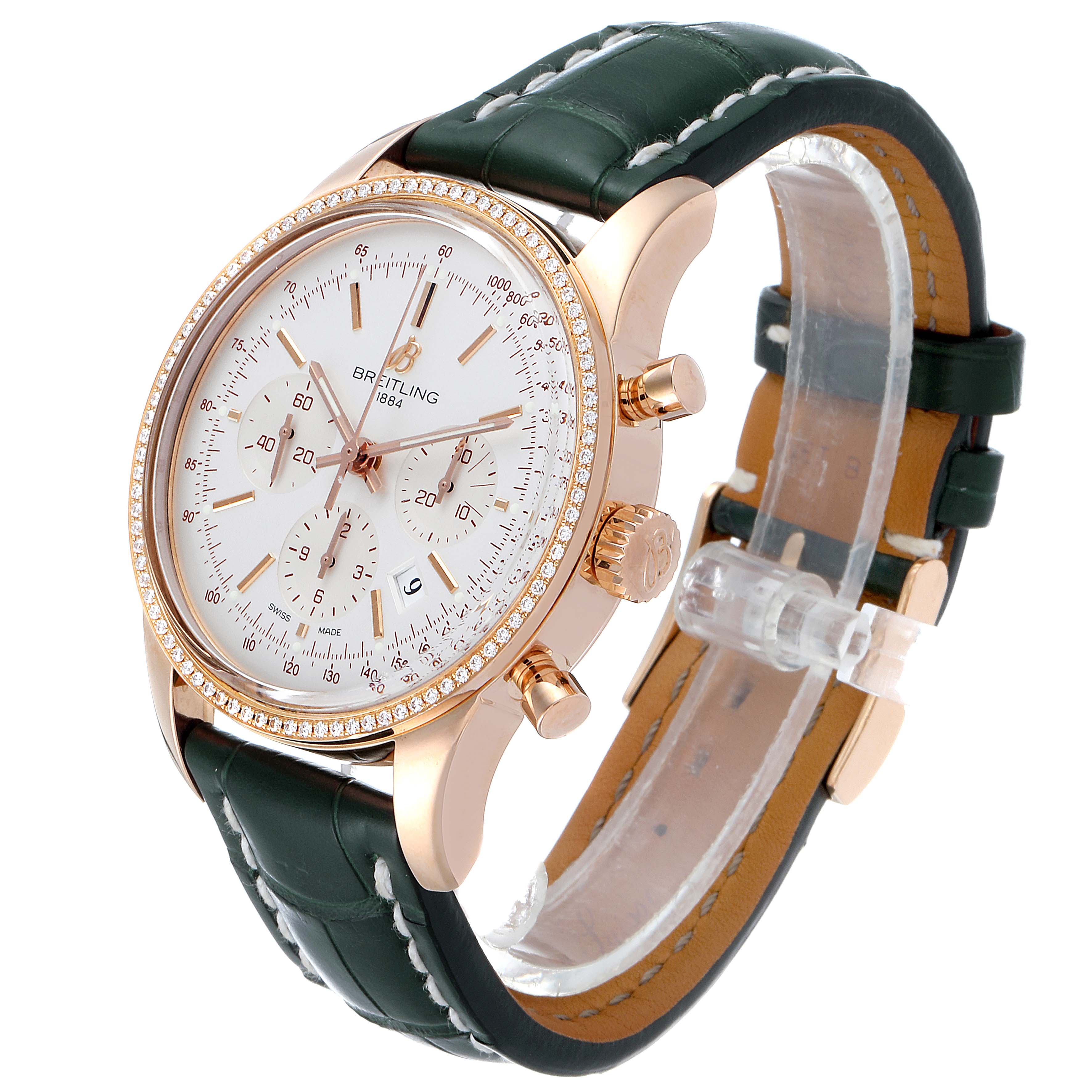 The Breitling Transocean RB0152 Men's Rose Gold Silver Dial RB0152 Men's Rose Gold Silver Dial watch is shown at a slight side angle, revealing the face, bezel, case, crown, chronograph buttons, and leather strap.