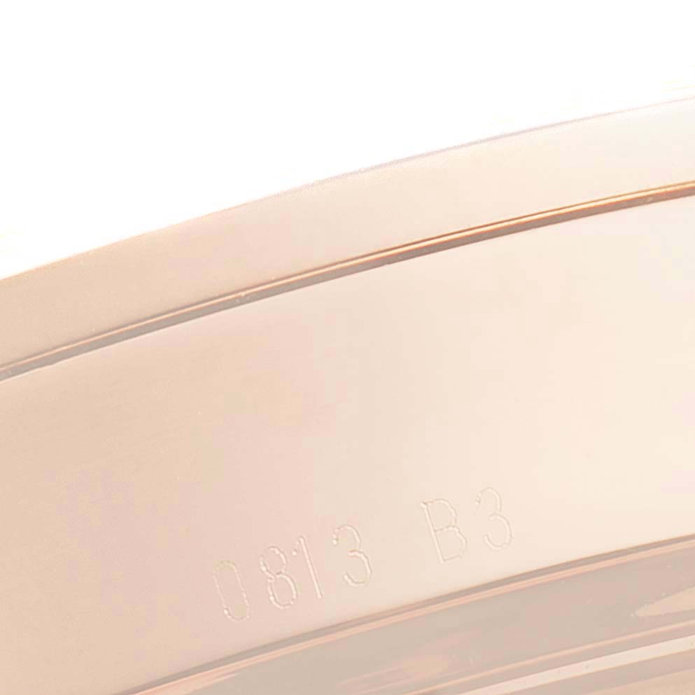 The image shows a close-up angle of the side of the Transocean model by Breitling, focusing on part of the watch's bezel and engraved serial number.