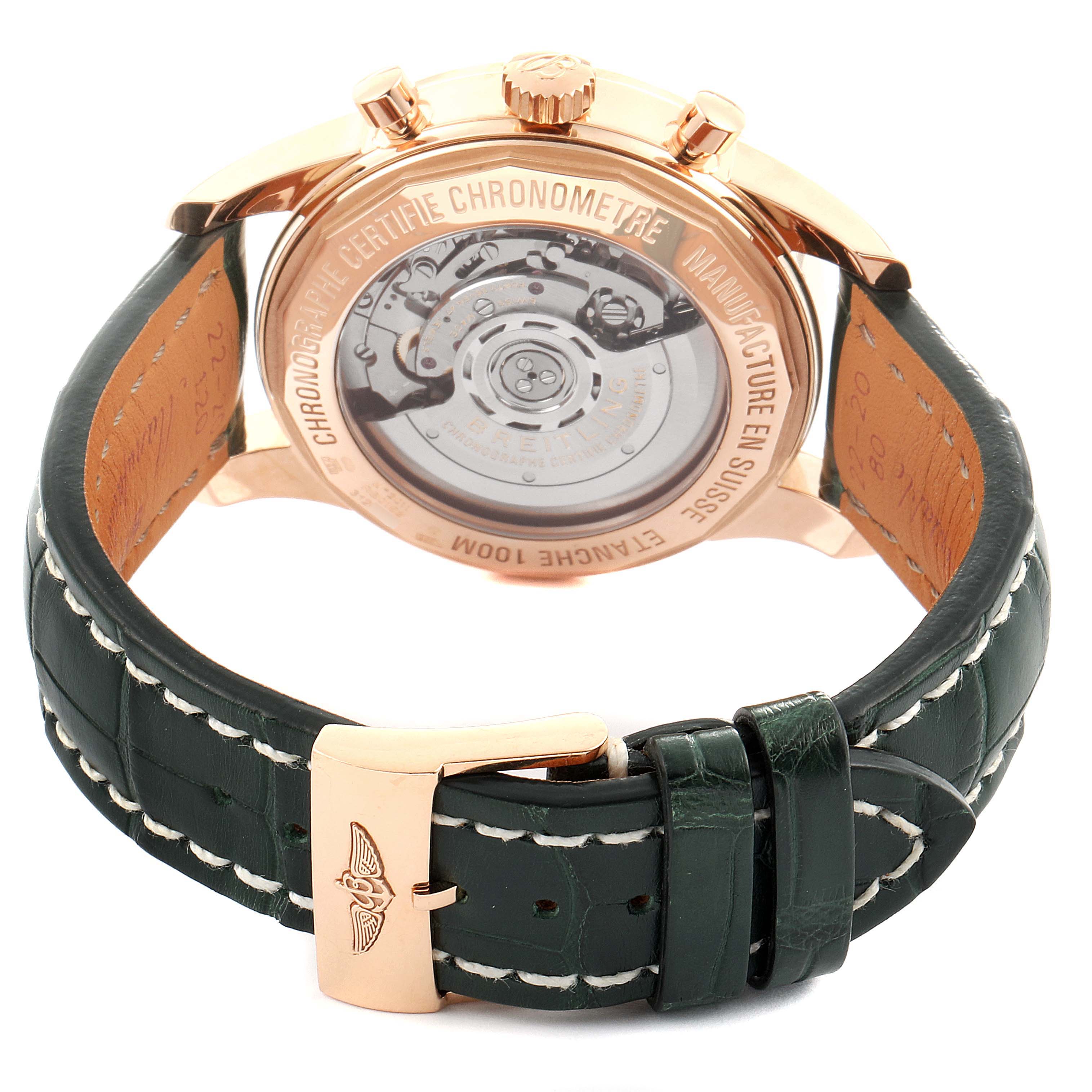 This image shows the back and clasp of a Breitling Transocean RB0152 Men's Rose Gold Silver Dial RB0152 Men's Rose Gold Silver Dial watch, displaying its movement and leather strap.