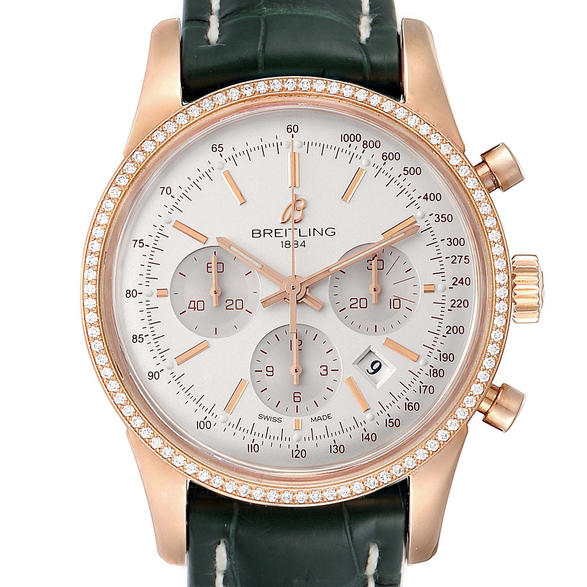 The image shows a frontal view of a Breitling Transocean RB0152 Men's Rose Gold Silver Dial RB0152 Men's Rose Gold Silver Dial watch, displaying its face, hands, subdials, bezel, and part of the strap.