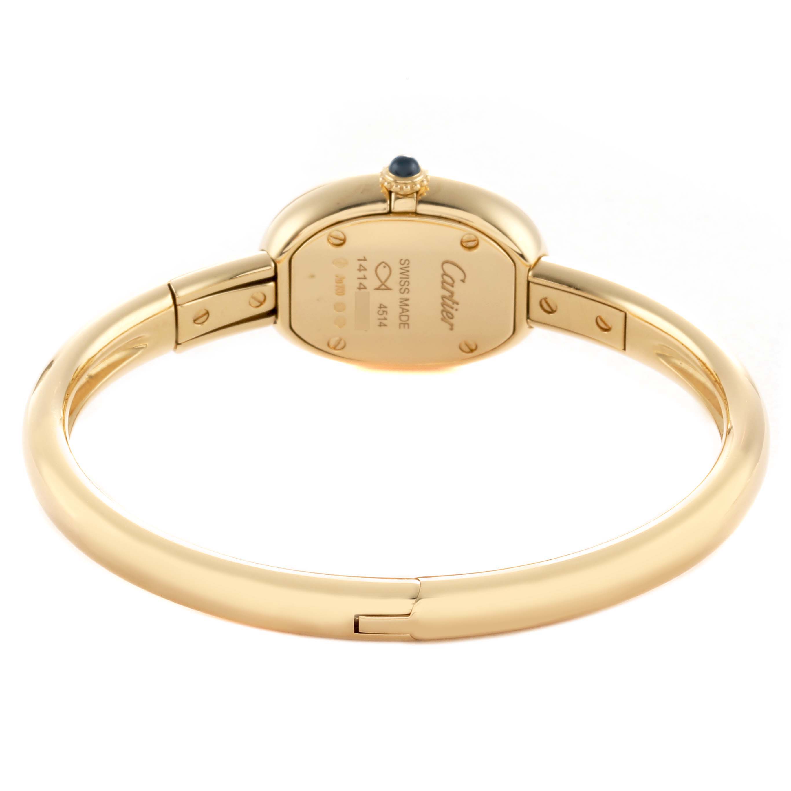 The image shows the back and side of a Cartier Baignoire WGBA0018 Women's Yellow Gold Silver Dial watch, highlighting the clasp and crown with a blue cabochon.