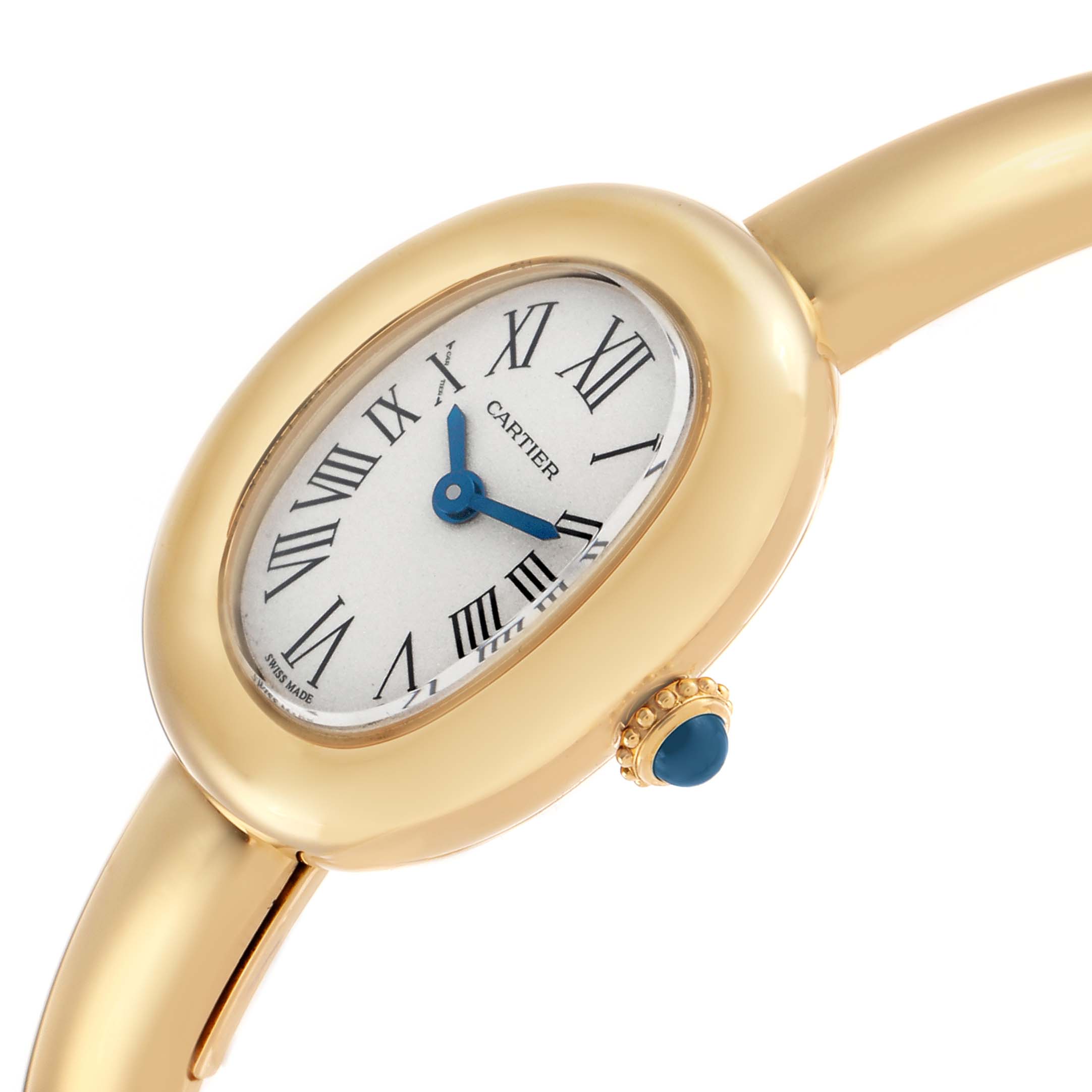 The Cartier Baignoire WGBA0018 Women's Yellow Gold Silver Dial watch is shown at an angled side view, highlighting its oval face, blue hands, and gold case with a blue cabochon crown.