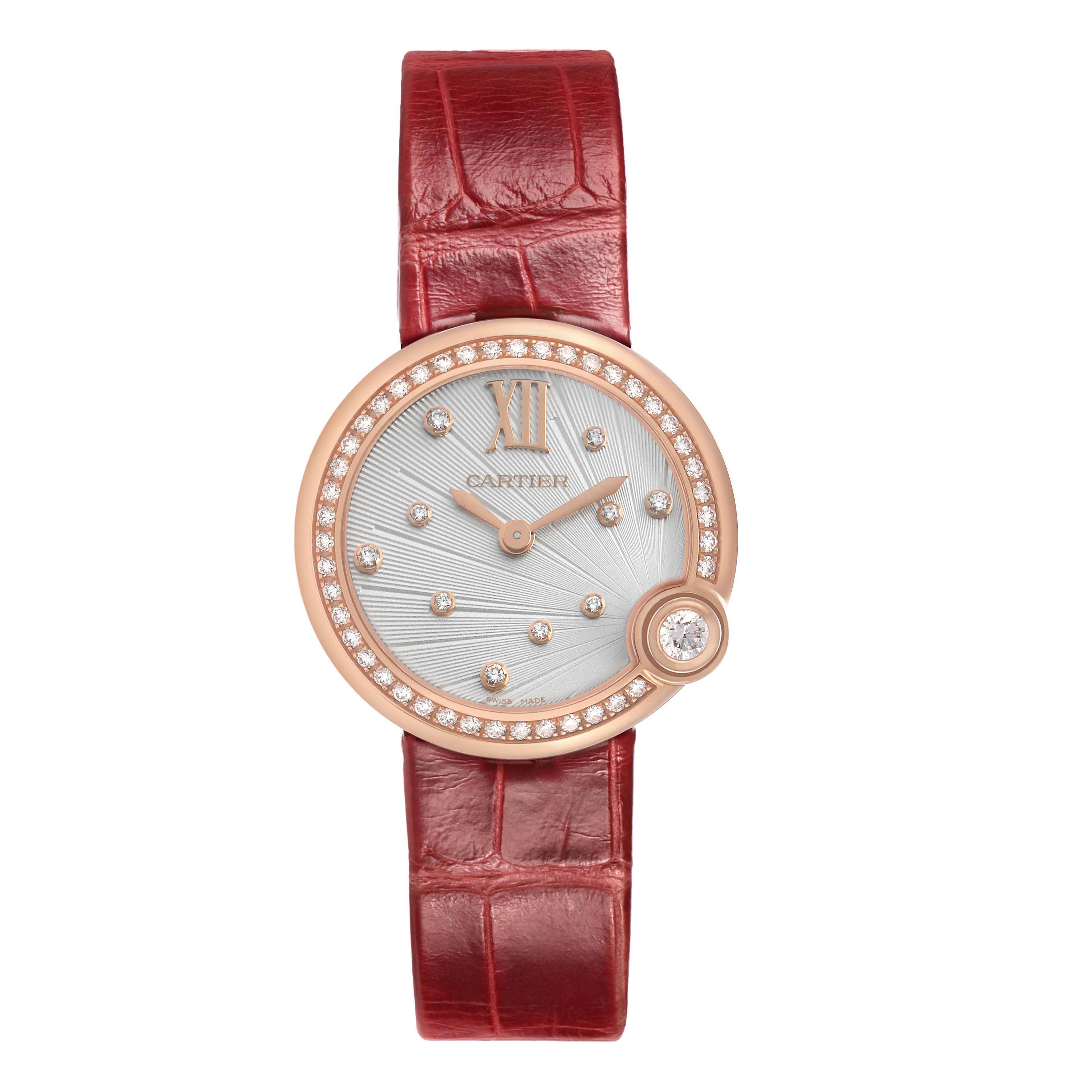 The Cartier Ballon Blanc WJBL0012 Women's Rose Gold Silver Dial watch is shown from the front, highlighting the dial, diamond bezel, and red strap.