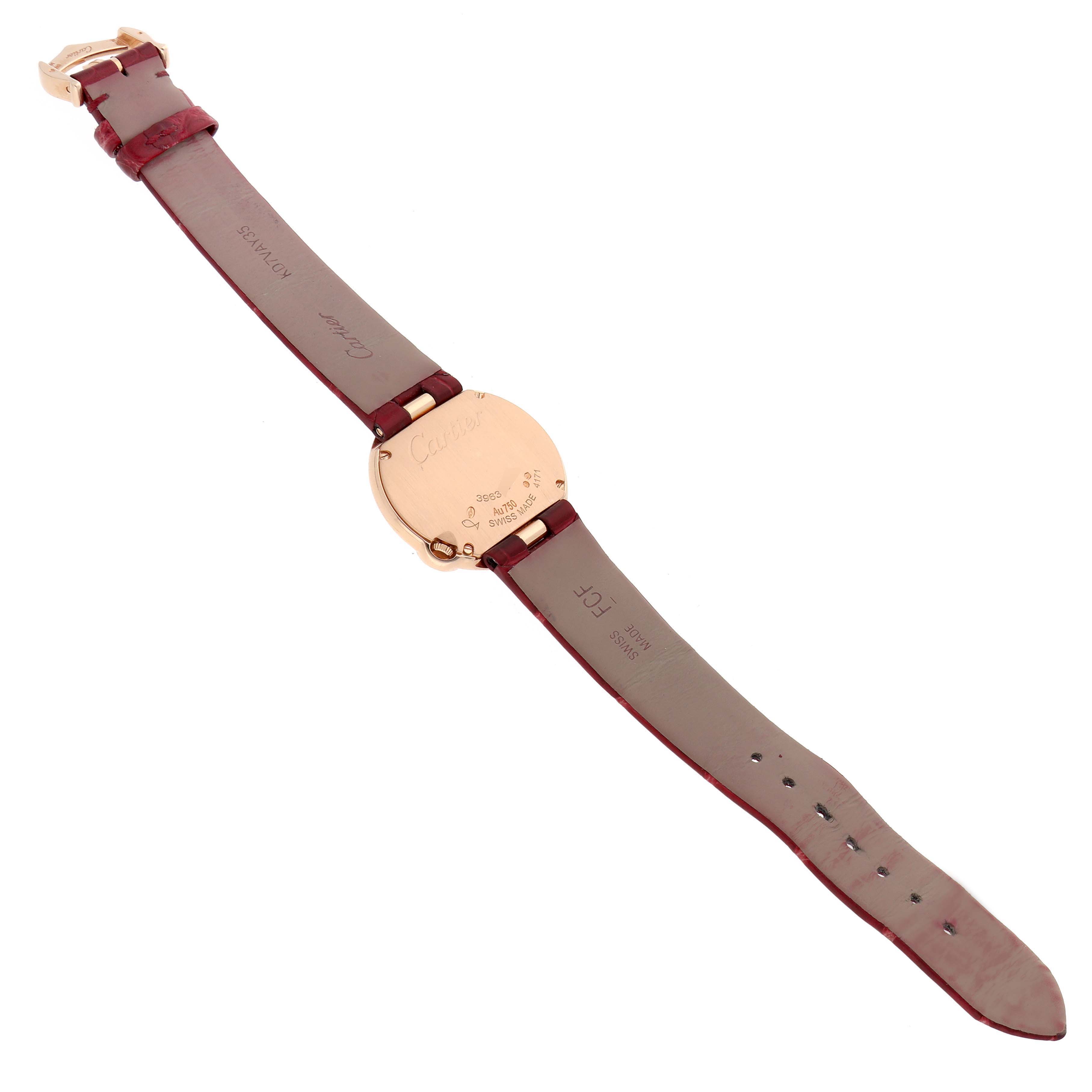 The Cartier Ballon Blanc WJBL0012 Women's Rose Gold Silver Dial watch is shown from the back, highlighting the case back, leather straps, and buckle.