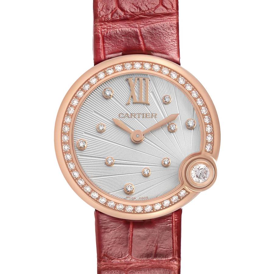 The Cartier Ballon Blanc WJBL0012 Women's Rose Gold Silver Dial watch is shown from a front angle, featuring a diamond-set bezel and a red leather strap.
