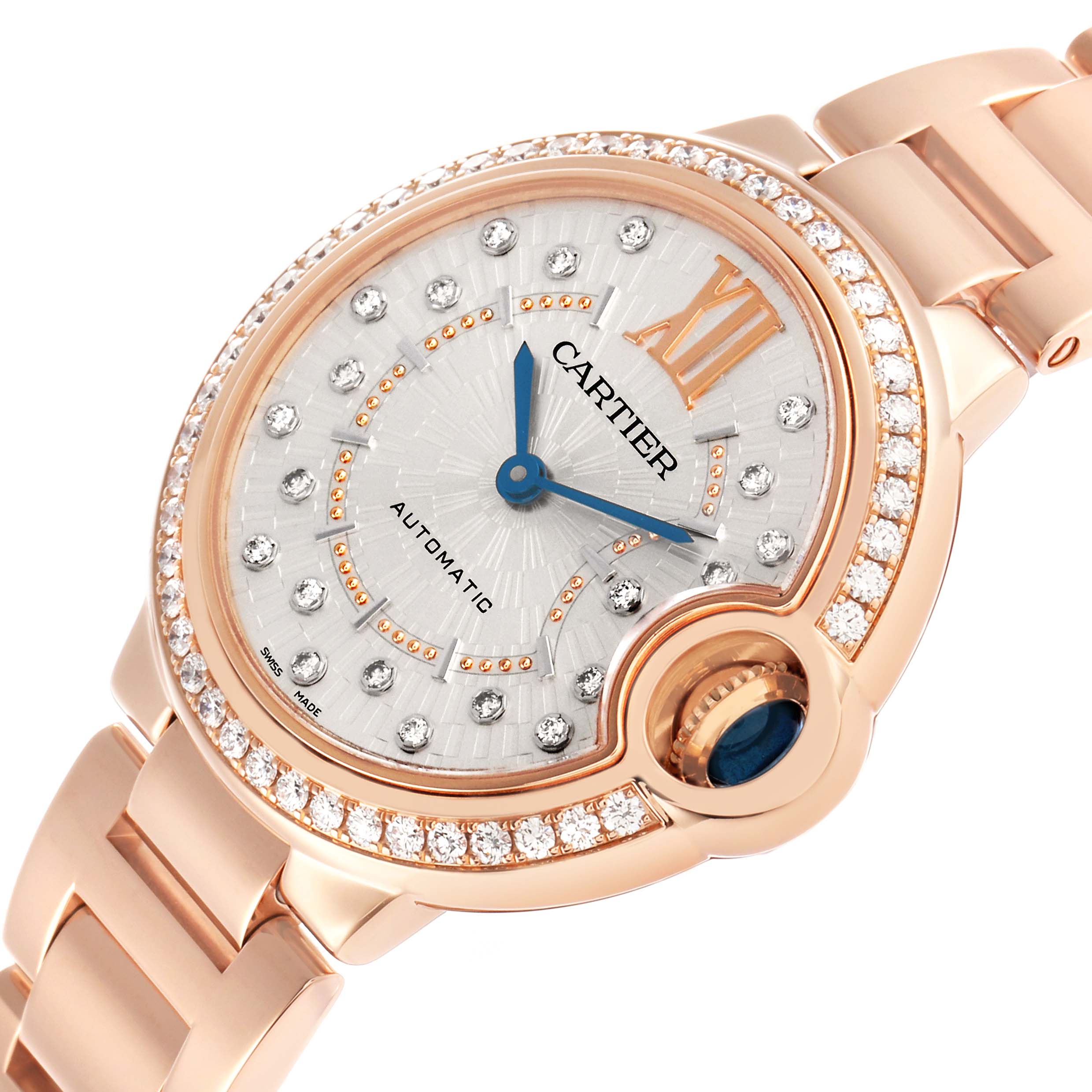 The image shows a Ballon Bleu de Cartier watch at an angled view, highlighting its rose gold case, diamond bezel, and blue sapphire crown.
