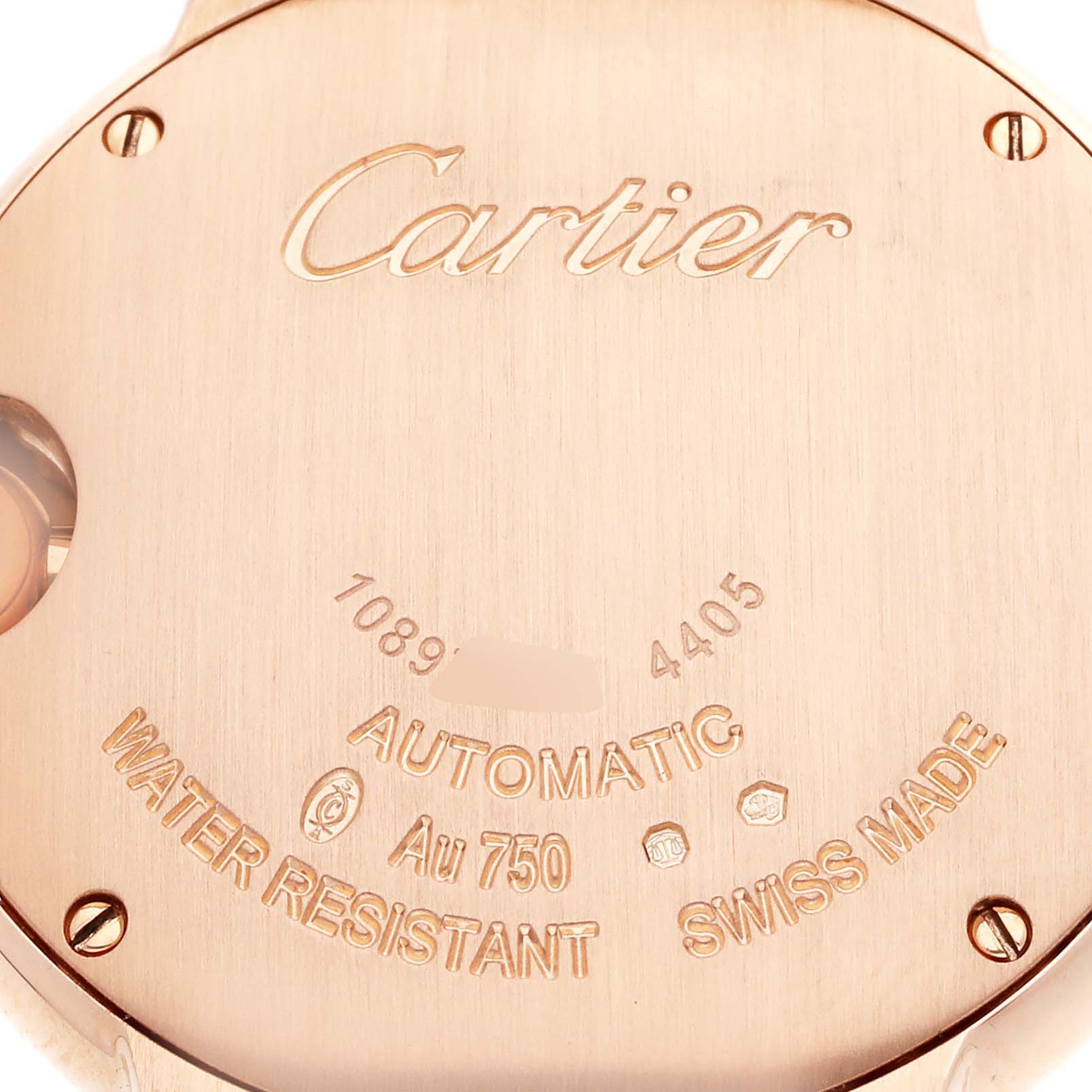 The image shows the back case of a Cartier Ballon Bleu WJBB0082 Women's Rose Gold Silver Dial watch, displaying branding and specifications.