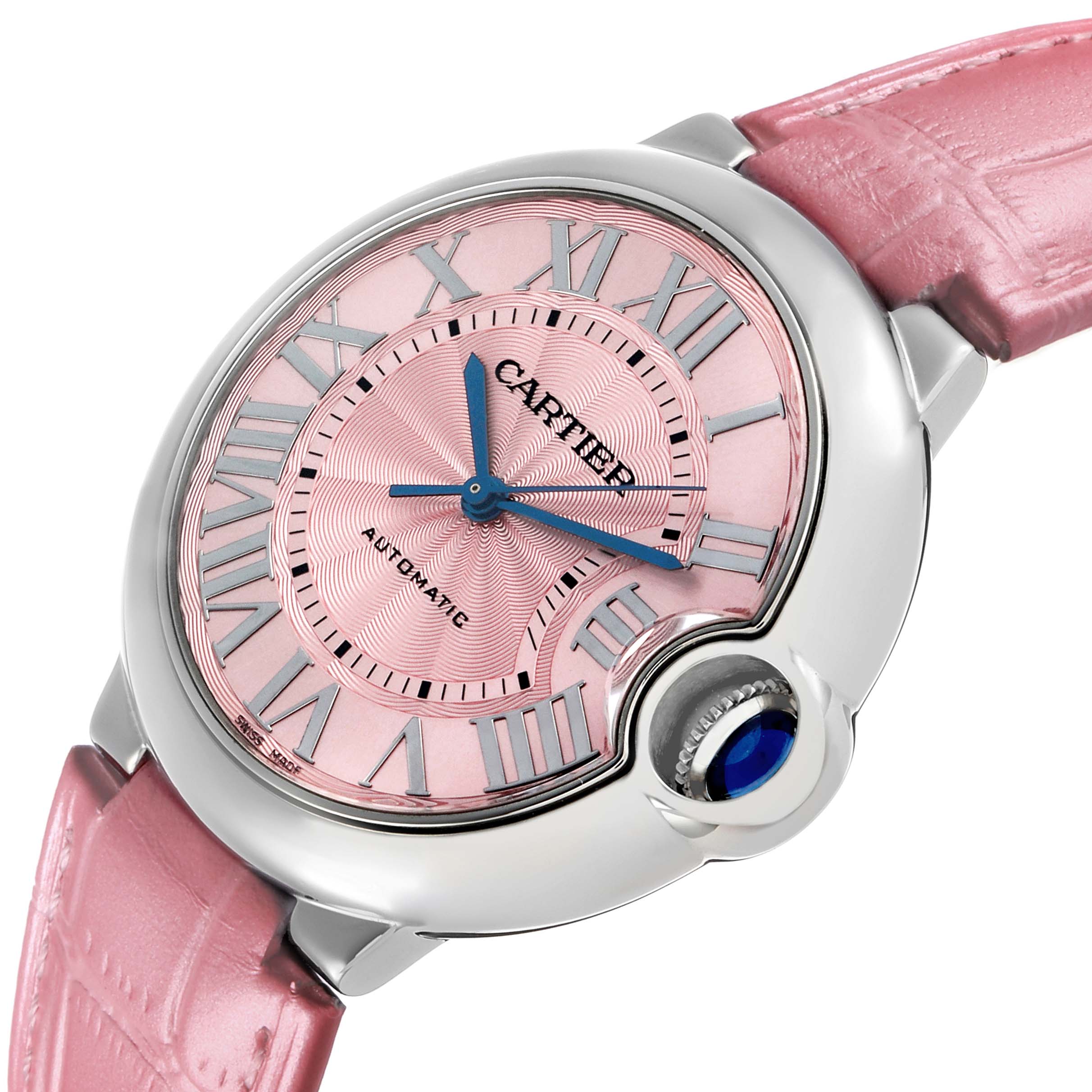 The Cartier Ballon Bleu WSBB0007 Women's Stainless Steel Pink Dial watch is shown at an angled close-up, displaying the dial, Roman numerals, and crown with a blue cabochon.