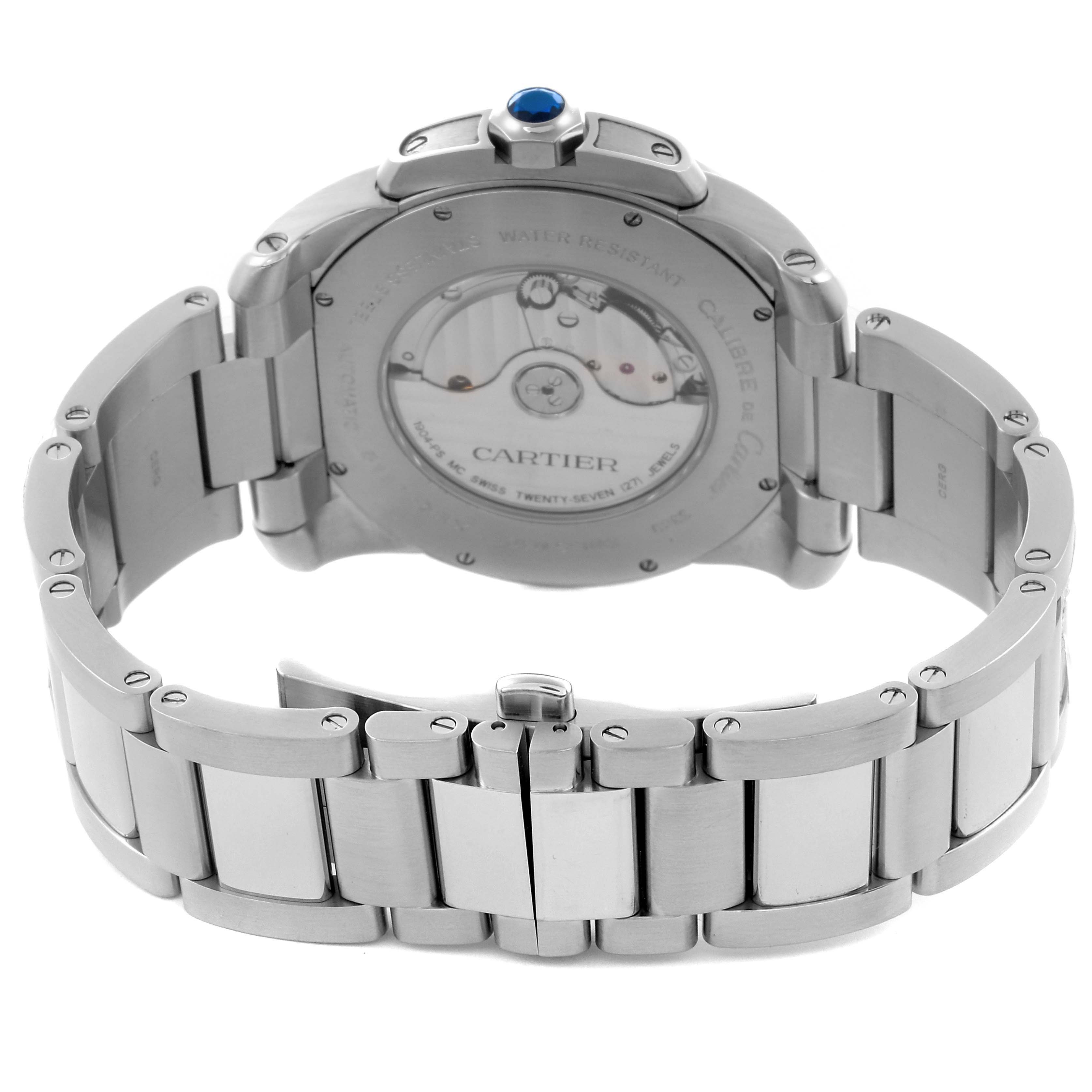 The image shows the back view of a Calibre de Cartier watch, highlighting the bracelet and transparent case back.