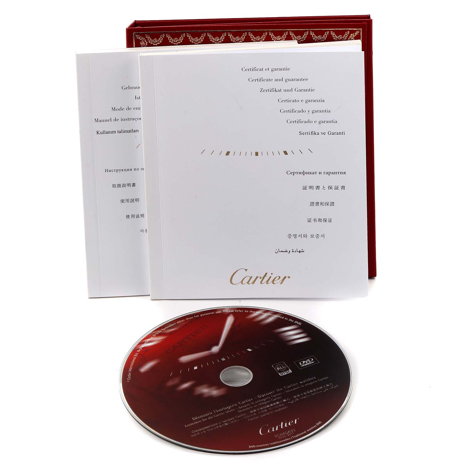 The image shows the packaging, manuals, and a DVD for the Calibre de Cartier watch by Cartier.