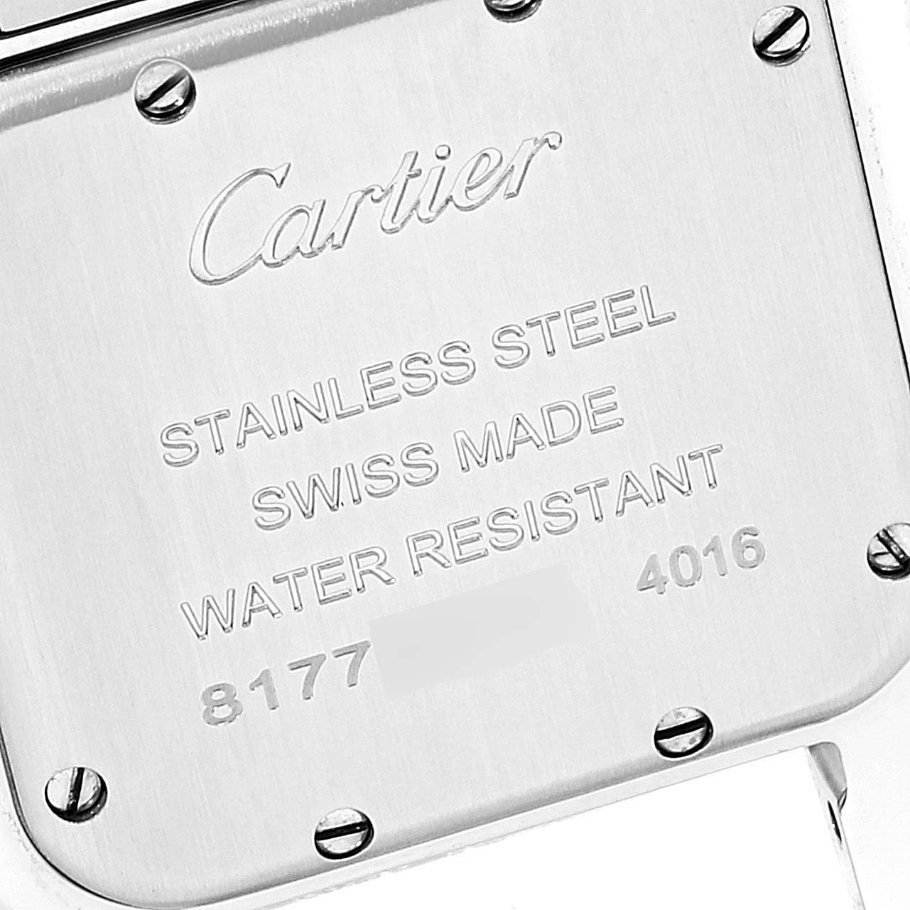 This image shows the back case of a Cartier Panthere WSPN0007 Women
s Stainless Steel Silver Dial WSPN0007 Women
s Stainless Steel Silver Dial watch, highlighting its engravings and screws.