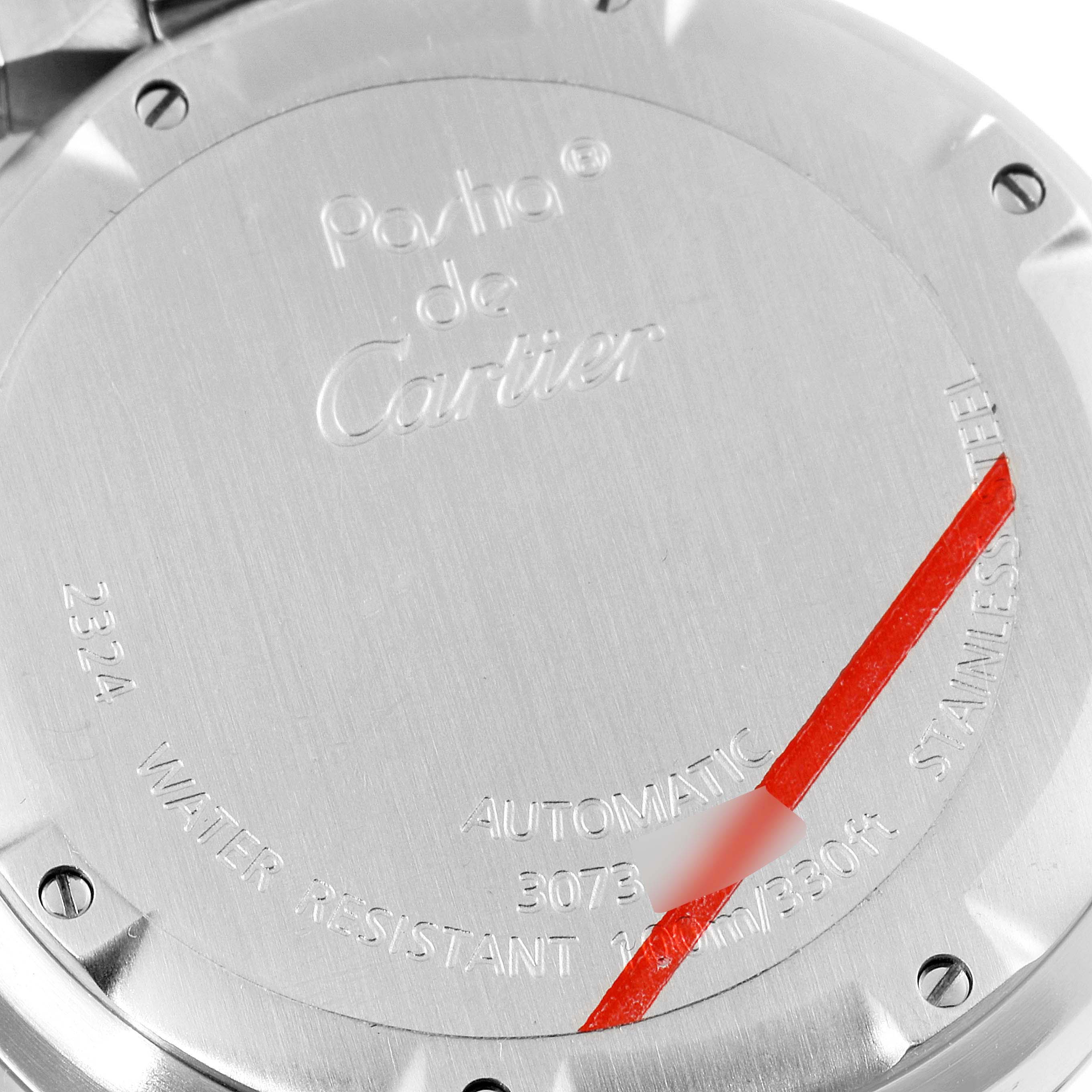 The image shows the back cover of a Pasha model watch by Cartier, displaying engravings and specifications.